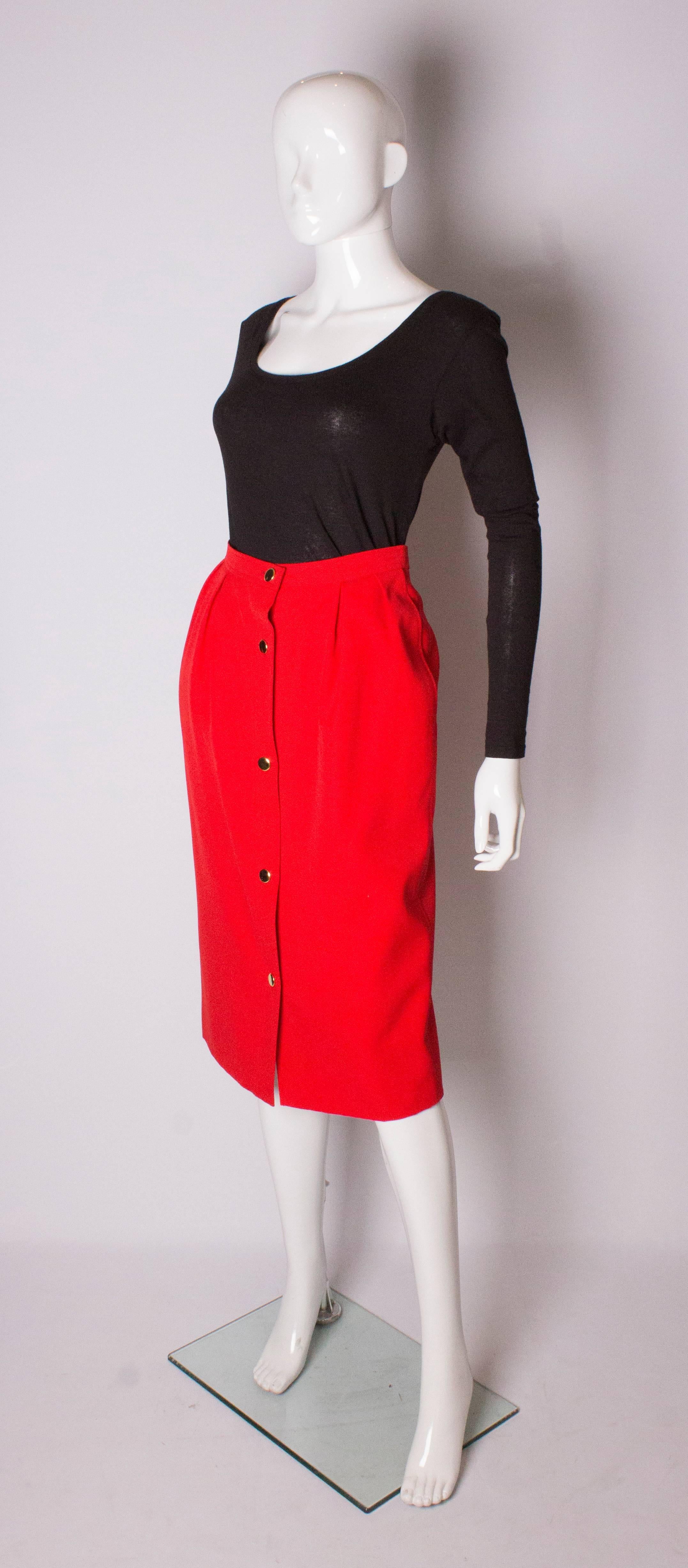 A great vintage  skirt by Yves Saint Laurent , Tricot line. The skirt is made of wool, and is fully lined. It has a pocket on either side, gathering at the front ,and a 5 button front opening.