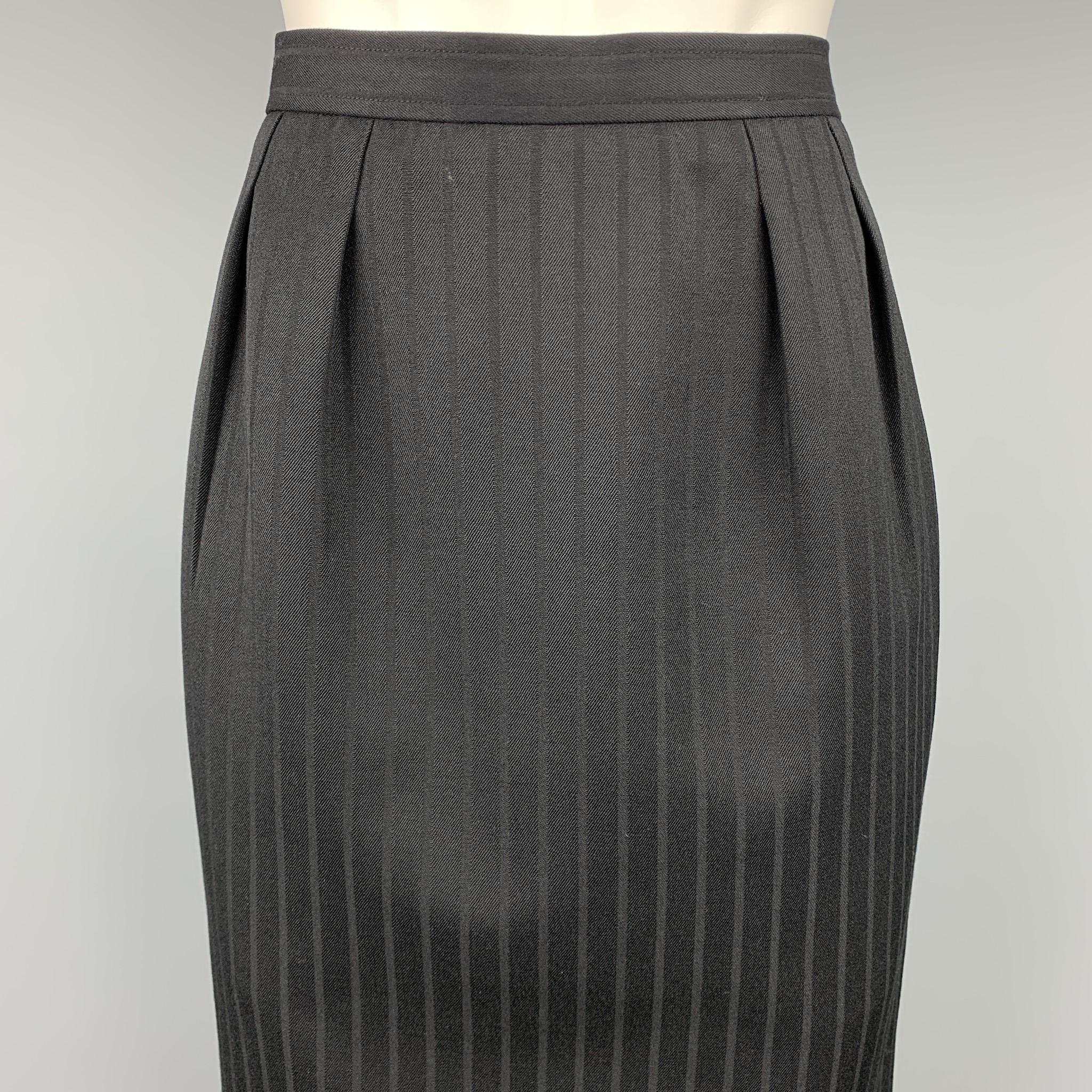 Vintage YVES SAINT LAURENT Rive Gauche skirt comes in a black stripe twill with a full liner featuring a pencil style, pleated, slit pockets, and a side button & zip up closure. Made in France.

Very Good Pre-Owned Condition.
Marked: