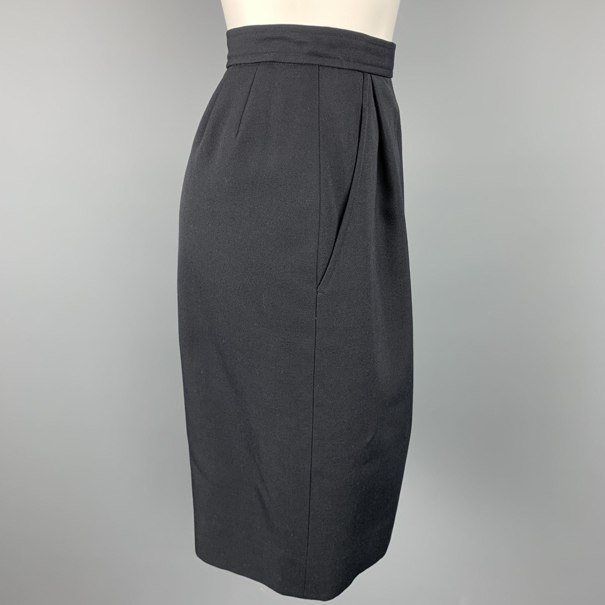 Vintage YVES SAINT LAURENT Rive Gauche skirt comes in a navy wool with a full liner featuring a pencil style, slit pockets, and a side button & zip up closure. Made in France.Very Good
Pre-Owned Condition. 

Marked:   38 

Measurements: 
  Waist: 27