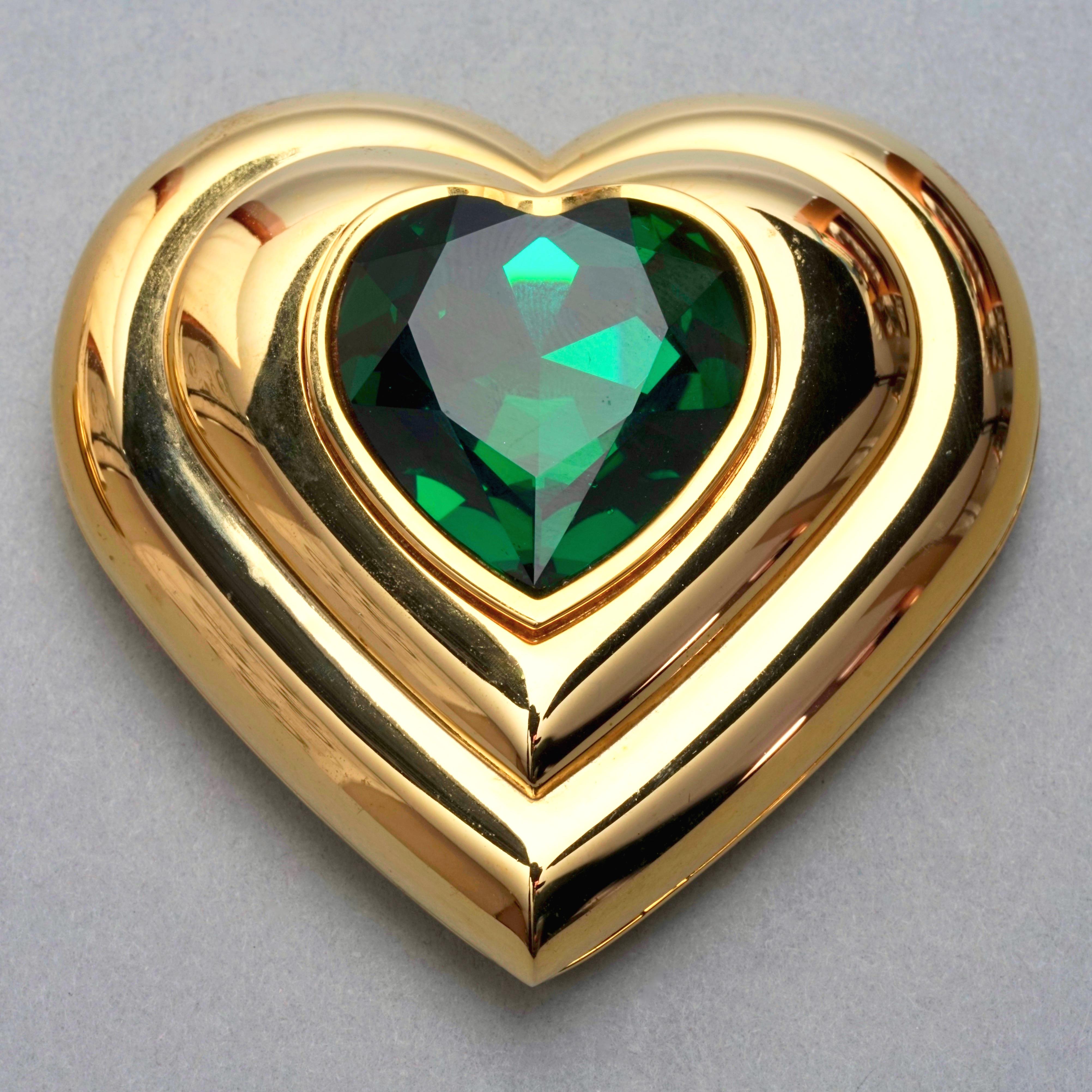 Vintage YVES SAINT LAURENT Robert Goossens Green Heart Jewelled Compact Powder

Measurements:
Height: 2.63 inches (6.7 cm)
Width: 2.63 inches (6.7 cm)

Features:
- 100% Authentic YVES SAINT LAURENT by Robert Goossens.
- Heart green rhinestone