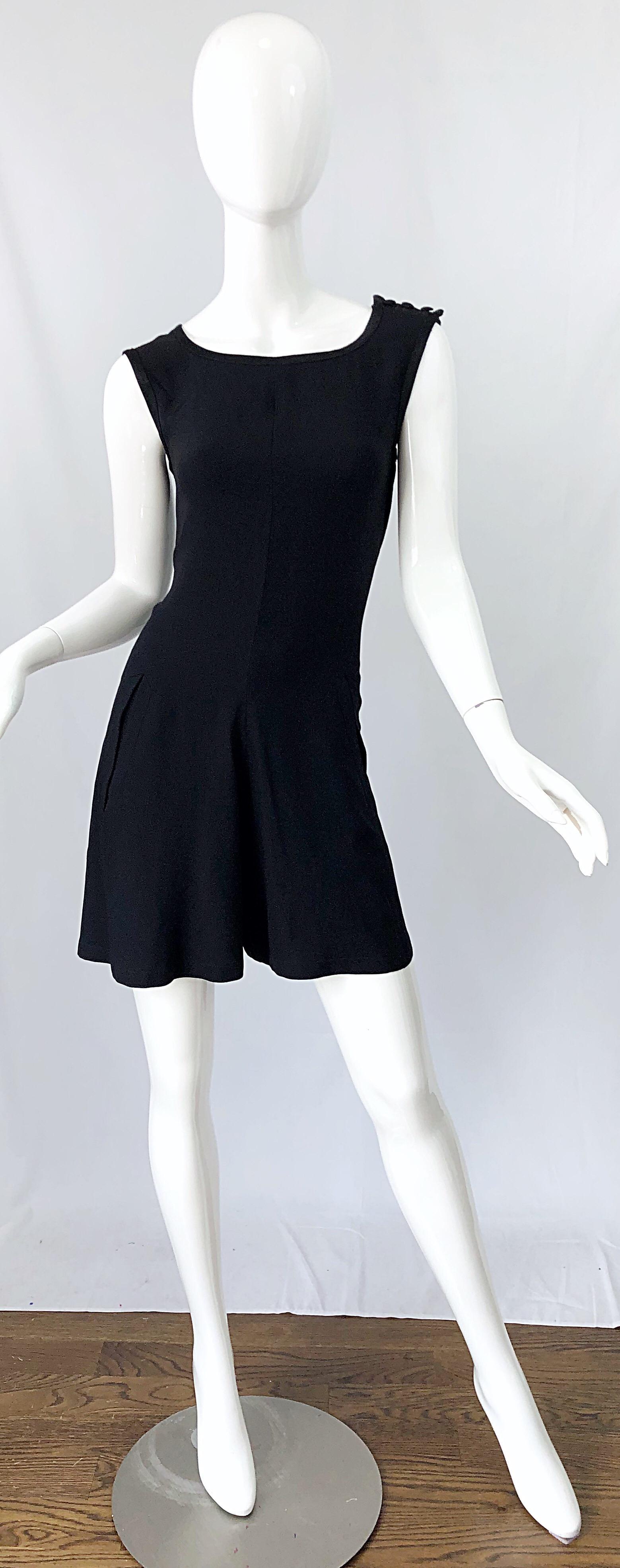 What's better than a little black dress? A vintage early 90s YVES SAINT LAURENT YSL Rive Gauche black sleeveless rayon romper / jumpsuit / playsuit ! Features a tailored bodice with wide legs. PCOKETS at each side of the hips. Hidden zipper up the