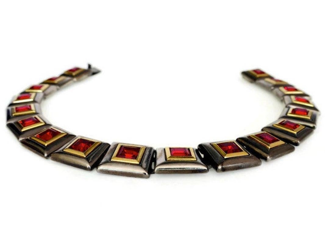 Vintage YVES SAINT LAURENT YSL Ruby Square Necklace

Measurements:
Height: 6/8 inch X 7/8 inch
Wearable Length: 16 inches
One Size Fits All

Features:
- 100% Authentic YVES SAINT LAURENT.
- Faceted ruby red glass stones set on square links.
- Square