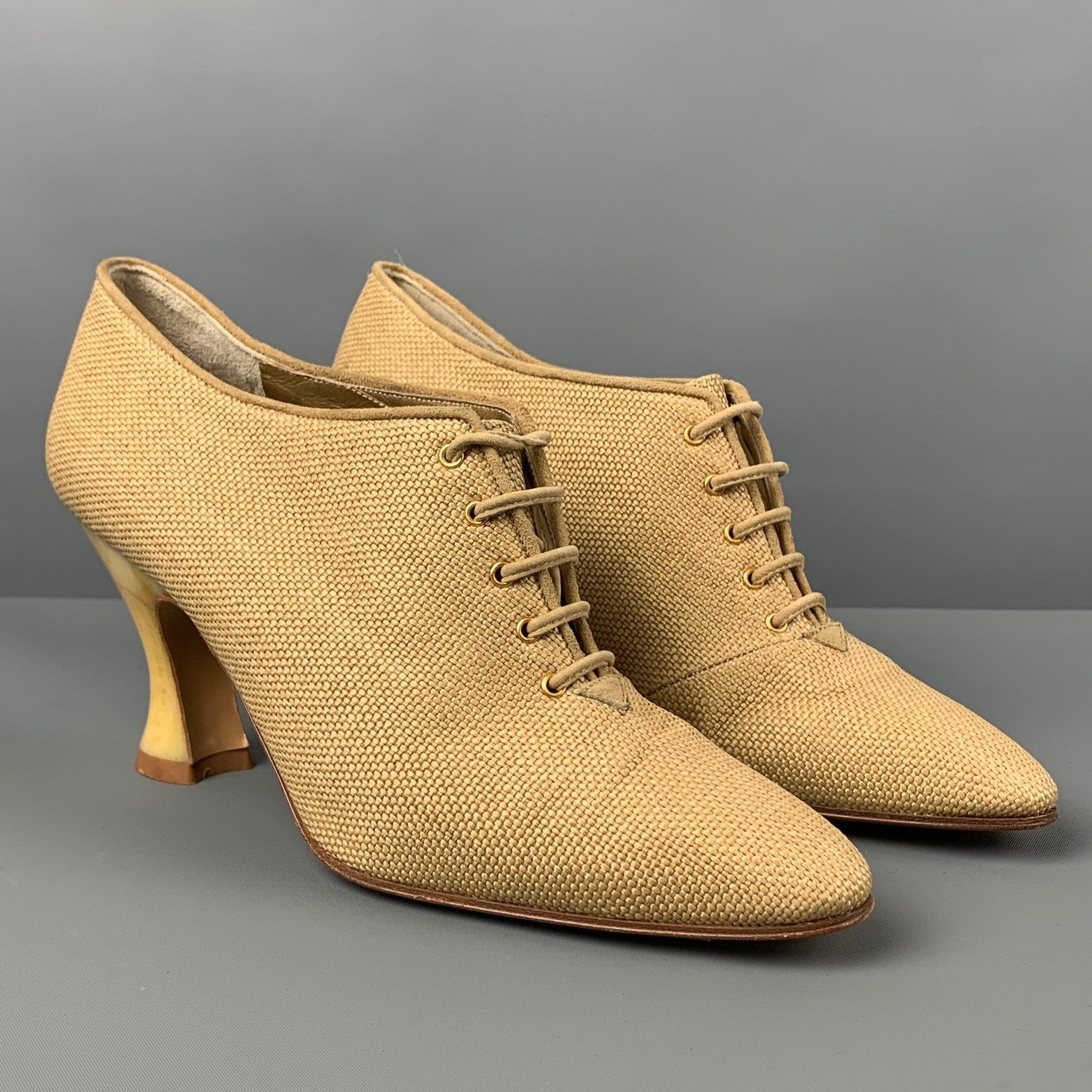 Vintage YVES SAINT LAURENT boots comes in a beige woven material featuring acetate heel and a lace up closure. Made in Italy.
Very Good
Pre-Owned Condition. 

Marked:   7.5 M  

Measurements: 
  Heel: 3.25 inches 
  
  
 
Reference: 120765
Category: