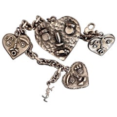 YVES SAINT LAURENT Steampunk Herz Faces Charm-Armband, Vintage