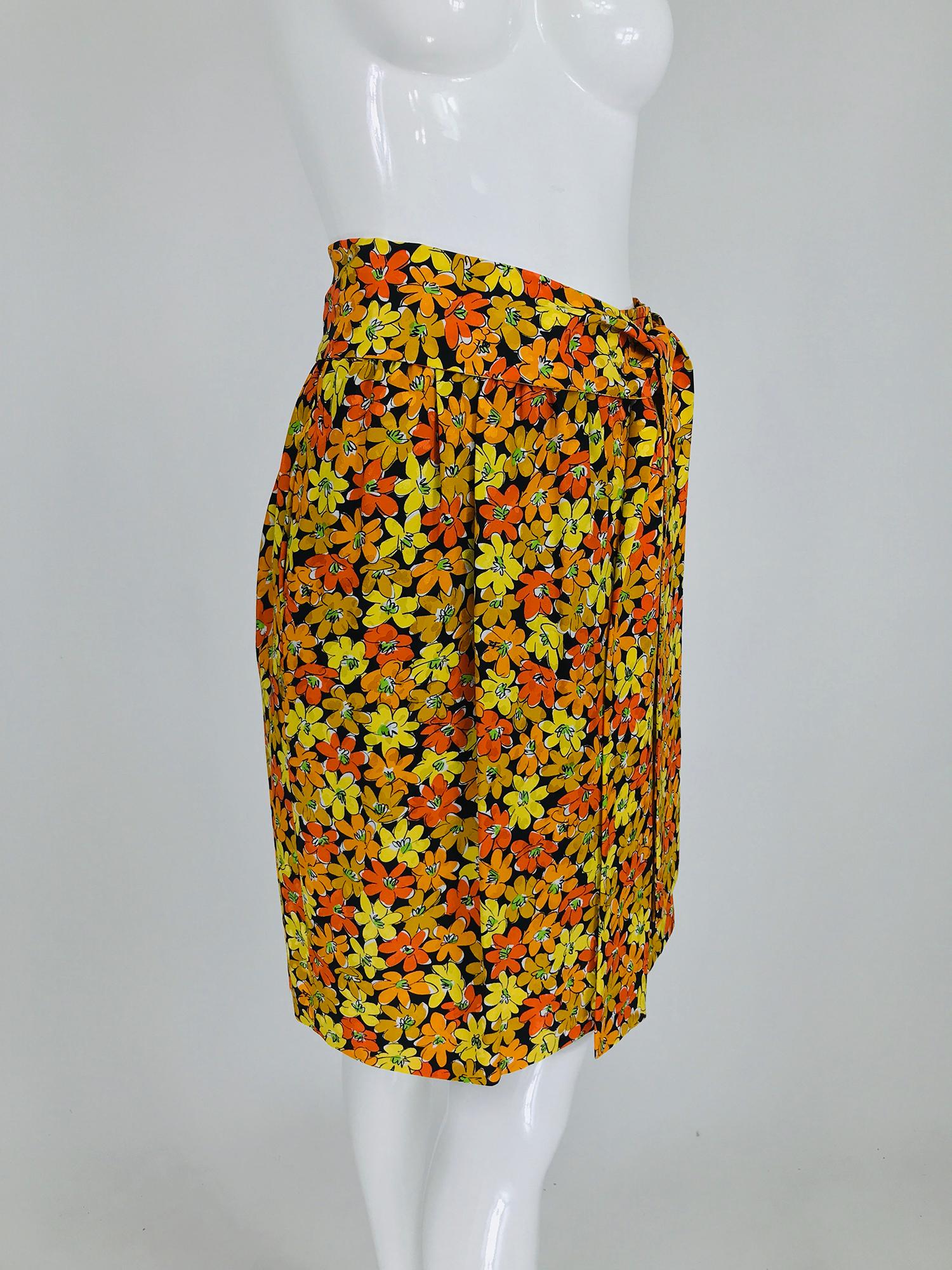 Vintage Yves Saint Laurent Rive Gauche vibrant floral silk print wrap skirt. This beautiful skirt is simple and elegant in style, a banded, gathered waist, the skirt wraps and closes with two bar hook at the front waist side. Together with the self