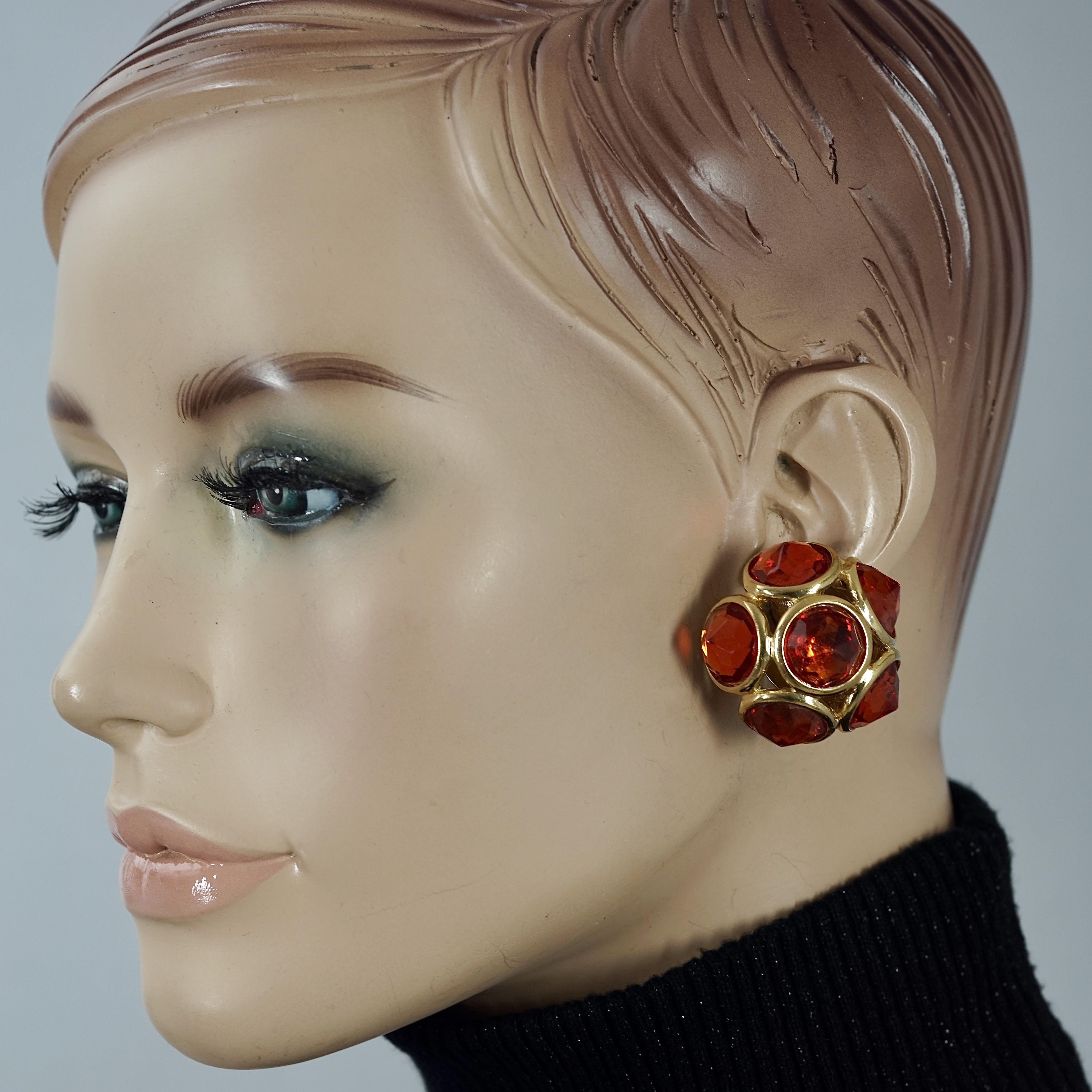 Vintage YVES SAINT LAURENT Ysl Amber Flower Earrings

Measurements:
Height: 1.37 inches (3.5 cm)
Width: 1.37 inches (3.5 cm)
Depth: 0.86 inch (2.2 cm)
Weight per Earring: 18 grams

Features:
- 100% Authentic Yves Saint Laurent.
- Faceted stones in