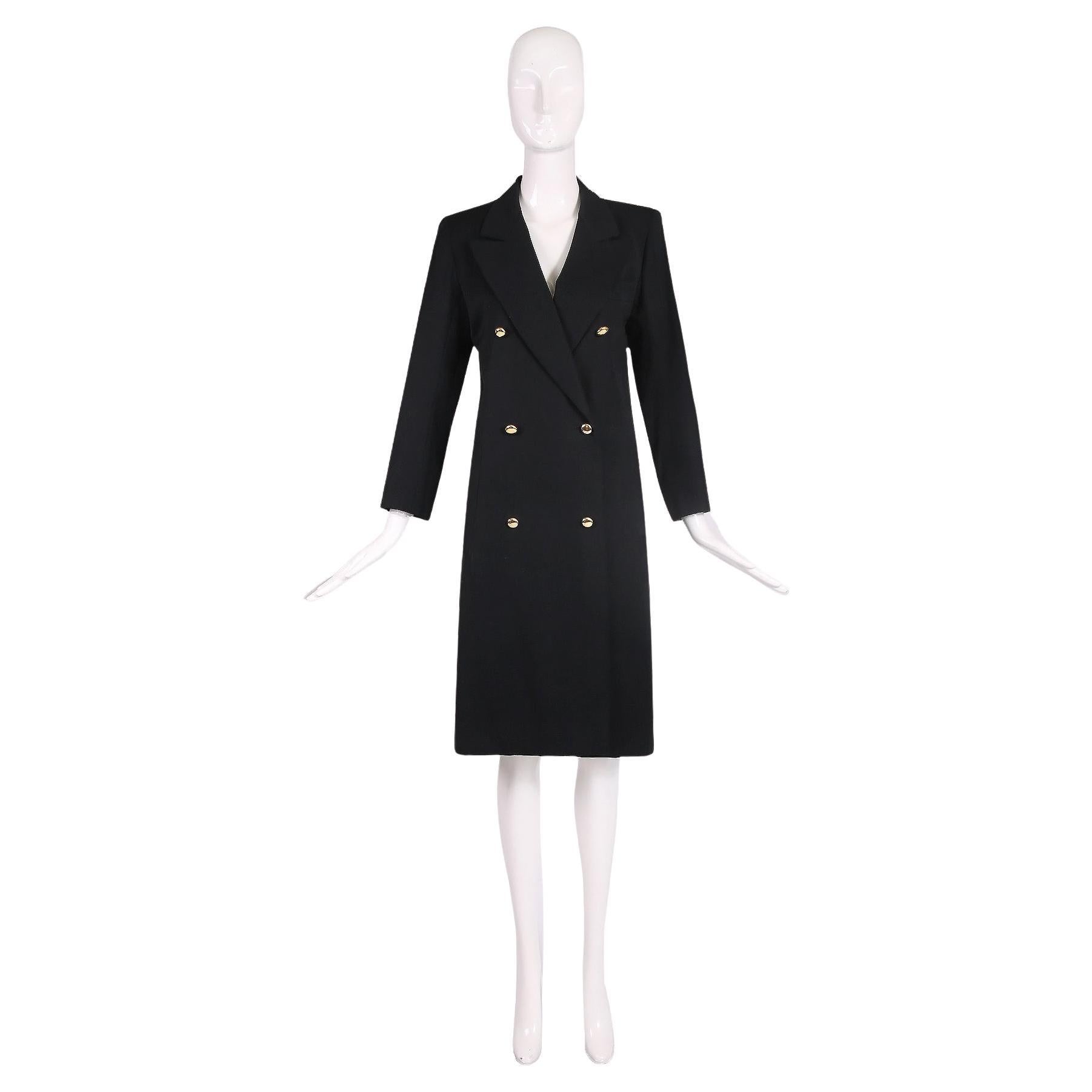 Late 1970's/early 80's Yves Saint Laurent black wool double breasted smoking coat w/gold domed buttons. Size tag 38. In excellent condition w/what looks like a small alteration at the interior - please ask questions. Please consult