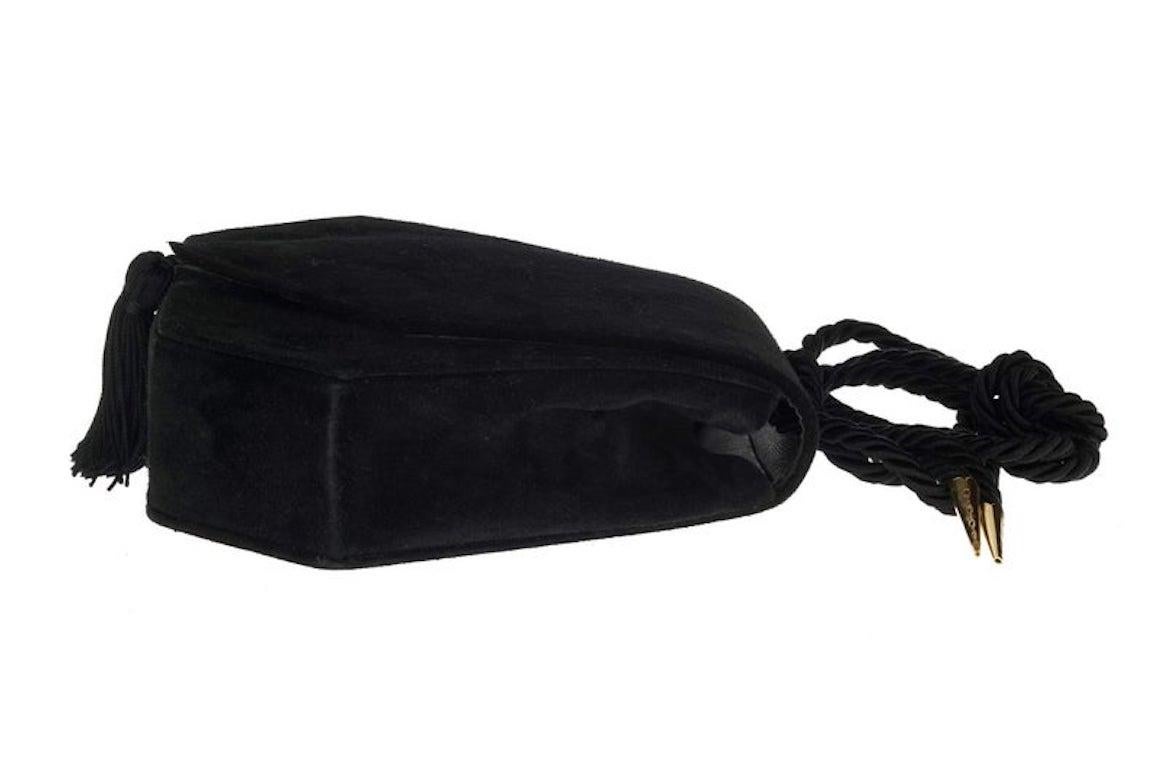 Vintage YVES SAINT LAURENT Ysl Black Tassel Suede Shoulder Bag

Measurements:
Height: 6.49 inches (16.5 cm)
Width: 6.69 inches ((17 cm)
Depth: 1.96 inches (5 cm)
Tassel: 2.56 inches (6.5 cm)
Strap: 42.51 inches (108 cm) can be adjusted