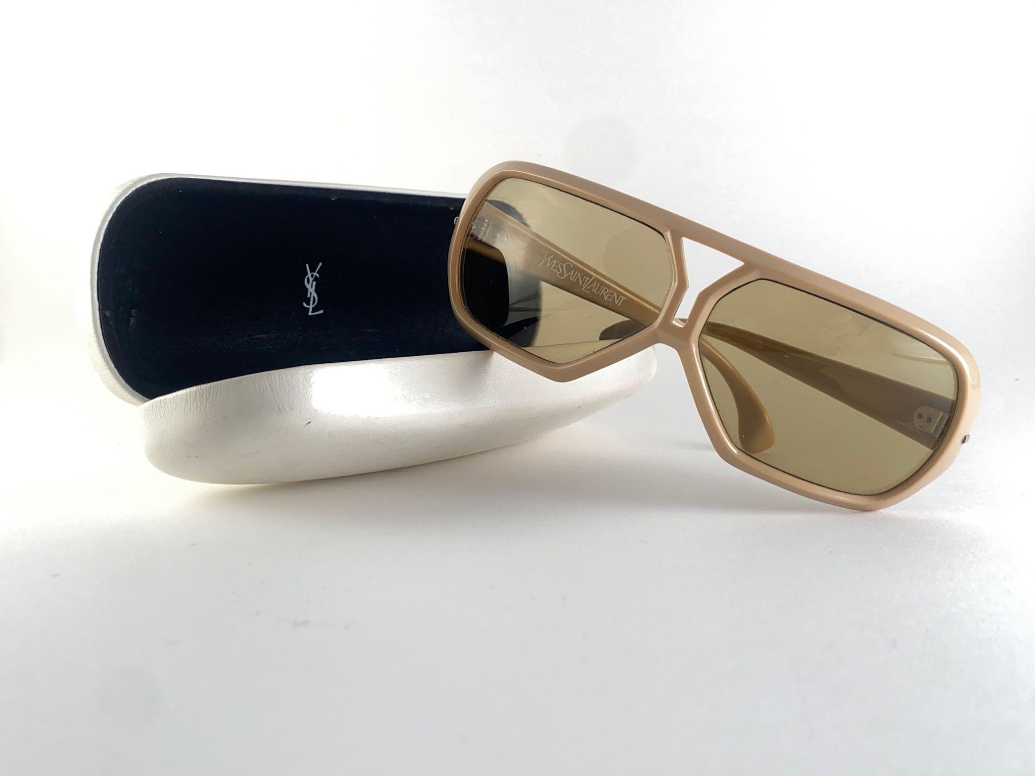 
Beautiful And Stylish Vintage Yves Saint Laurent 1980’S Bug Eyed Sunglasses.
Spotless Pair Of Medium Brown Lenses. 
New! Never Worn Or Displayed. Flawless Pair!!!   
This Pair Could Show Minor Sign Of Wear Due To Storage. 
A Great Opportunity To