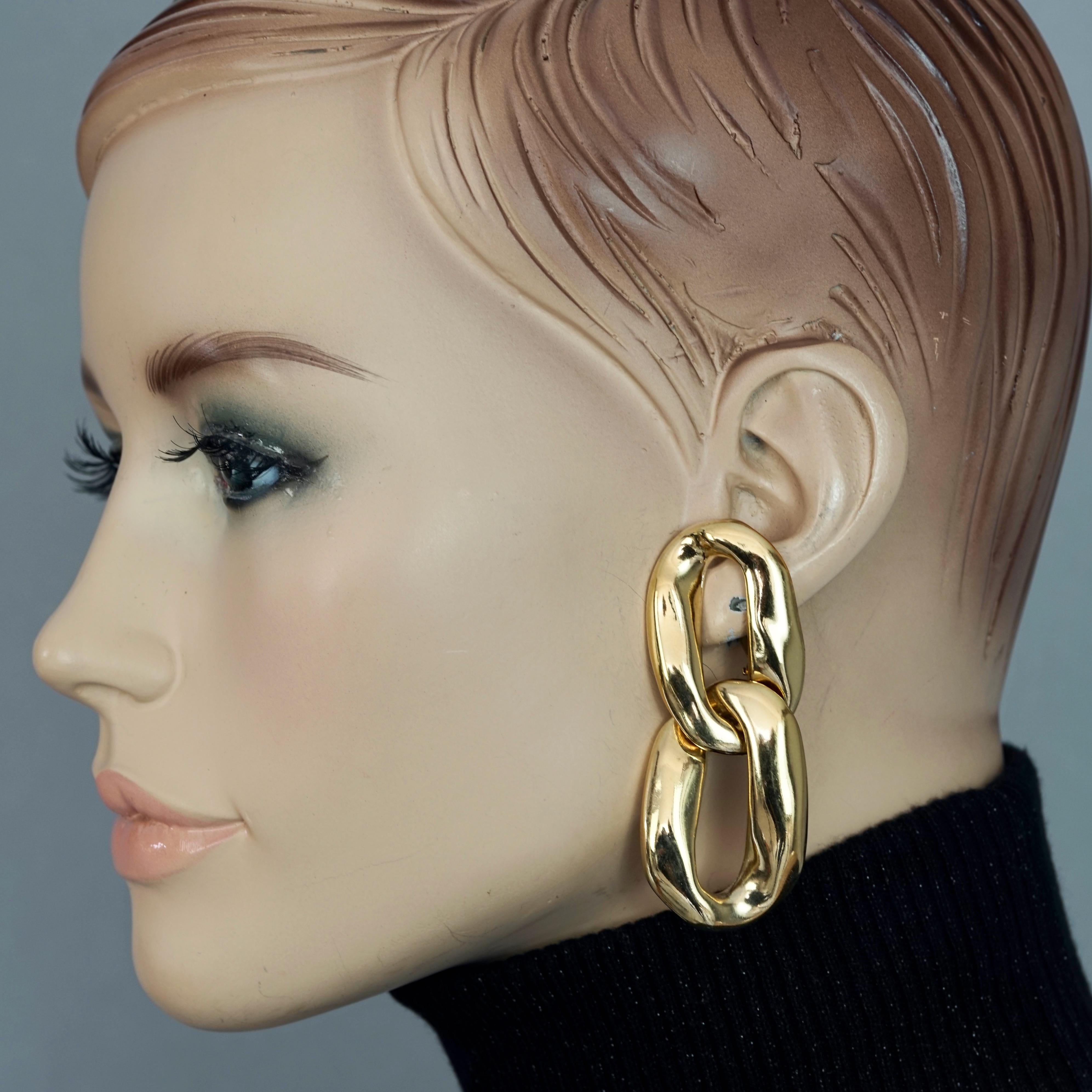Vintage YVES SAINT LAURENT Ysl by Robert Goossens Chunky Chain Earrings

Measurements:
Height: 2.67 inches (6.8 cm)
Width: 1.10 inches (2.8 cm)
Weight per Earring: 24 grams

Features:
- 100% Authentic YVES SAINT LAURENT.
- Chunky chain links.
- Clip