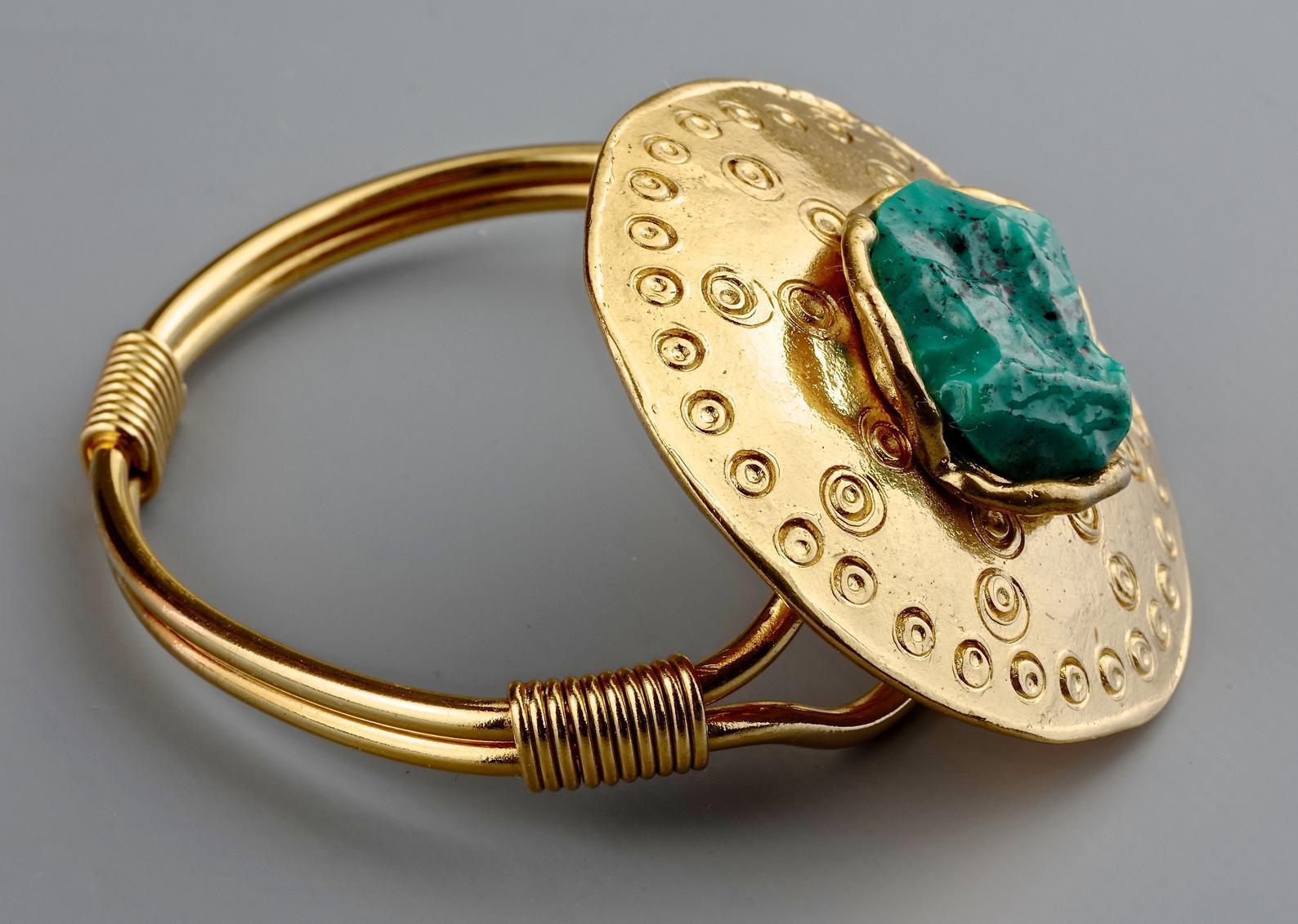 Vintage YVES SAINT LAURENT Ysl by Robert Goossens Ethnic Turquoise Stone Disc Medallion Cuff Bracelet

Measurements:
Height: 1.93 inches (4.9 cms)
Wearable Length: : 6.50 inches (16.5 cms)

Features:
- 100% Authentic YVES SAINT LAURENT by Robert