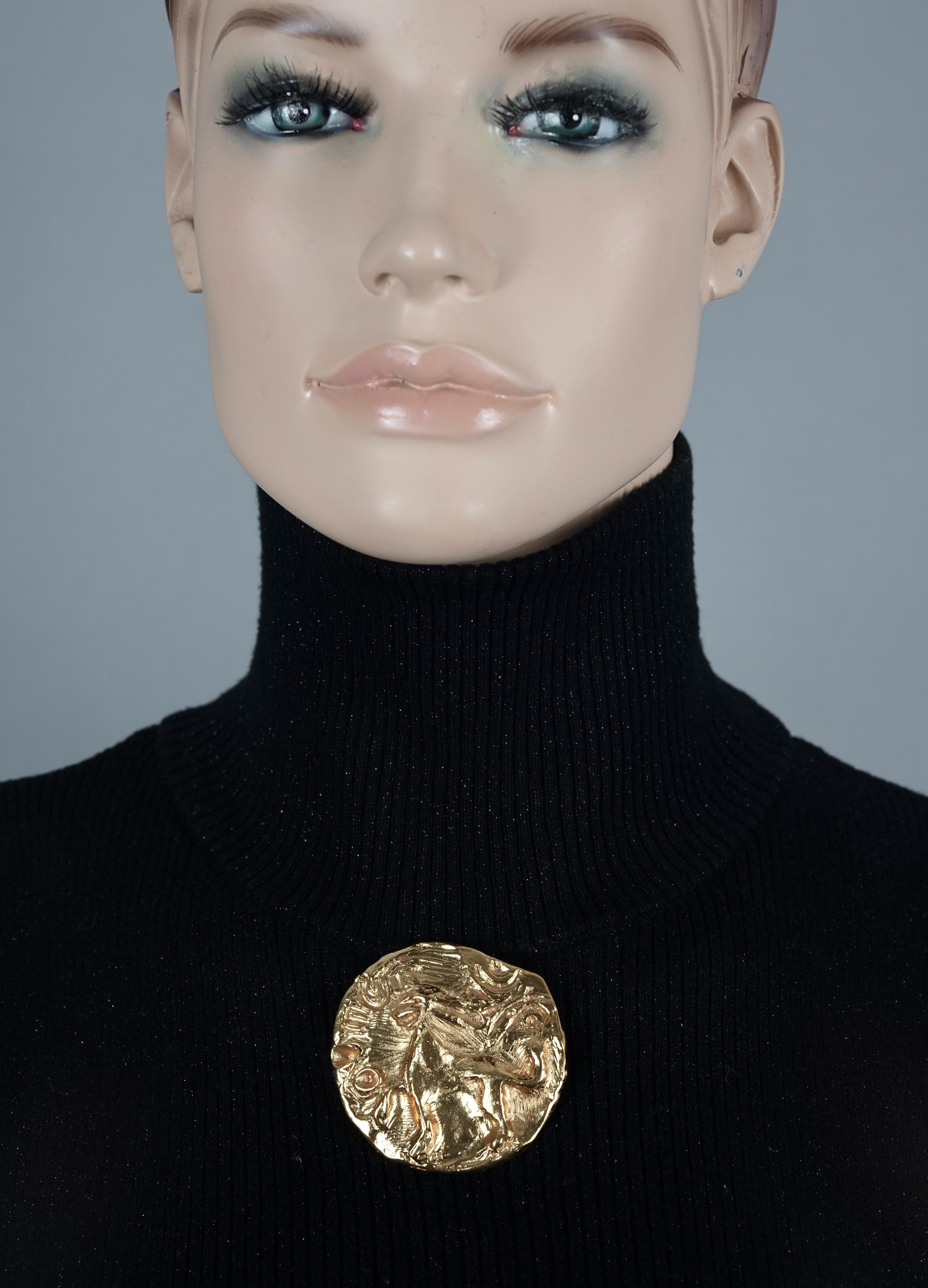 Vintage YVES SAINT LAURENT Ysl by Robert Goossens Lion Medallion Pendant Brooch

Measurements:
Height: 2.20 inches (5.6 cm)
Width: 2.20 inches (5.6 cm)

Features:
- 100% Authentic YVES SAINT LAURENT by Robert Goossens.
- Textured and raised lion