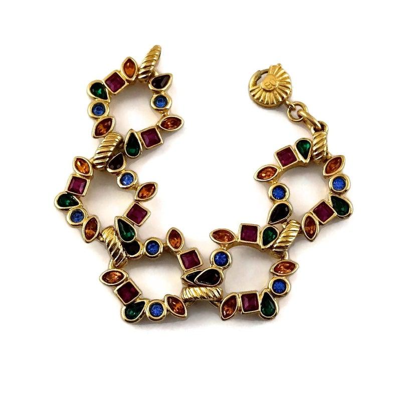 Vintage YVES SAINT LAURENT Ysl by Robert Goossens Multi Color Rhinestones Bracelet

Measurements:
Height: 1.14 inches (2.9 cm)
Wearable Length: 7.08 inches (18 cm)

Features:
- 100% Authentic YVES SAINT LAURENT.
- Multi coloured faceted glass stones