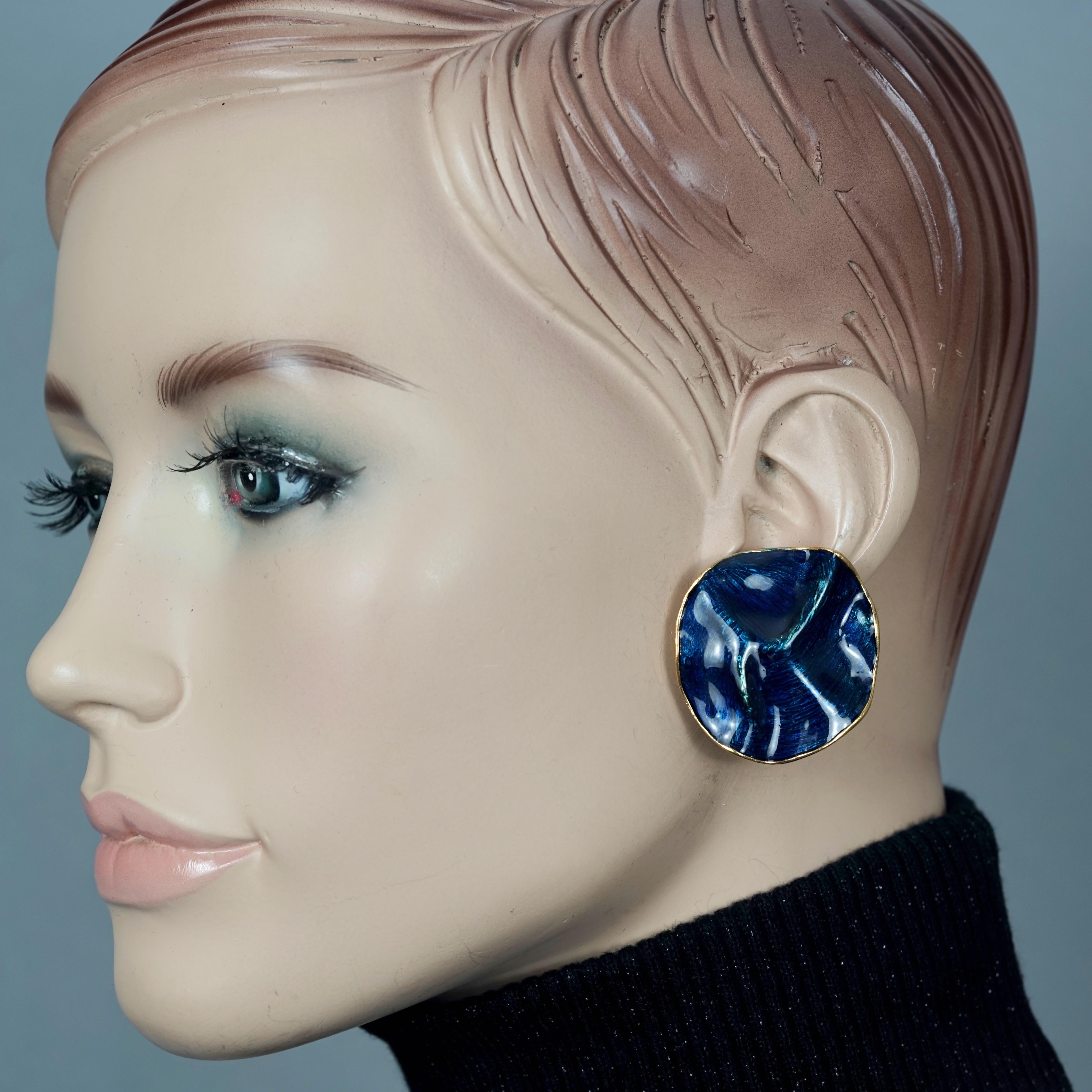 Vintage YVES SAINT LAURENT Ysl by Robert Goossens Wrinkled Blue Enamel Disc Earrings

Measurements:
Height: 1.41 inches (3.6 cm)
Width: 1.50 inches (3.8 cm)
Weight per Earring: 17 grams

Features:
- 100% Authentic YVES SAINT LAURENT by Robert