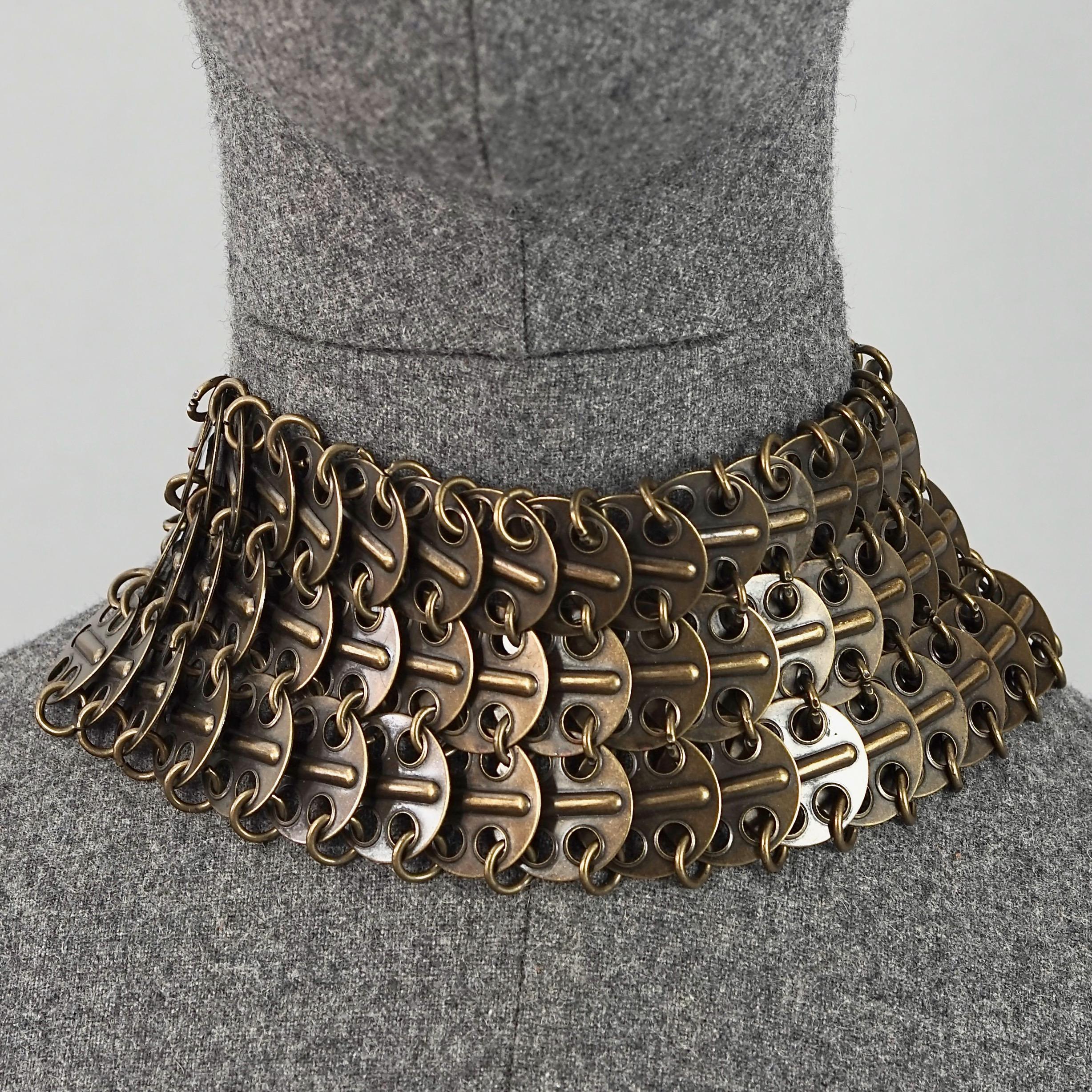 Vintage YVES SAINT LAURENT Ysl Chainmail Disc Bronze Choker Necklace

Measurements:
Height: 2.75 inches (7 cm)
Wearable Length: 12.99 inches (33 cm) until 15.75 inches (40 cm)

Features:
- 100% Authentic YVES SAINT LAURENT.
- Metal chainmail choker