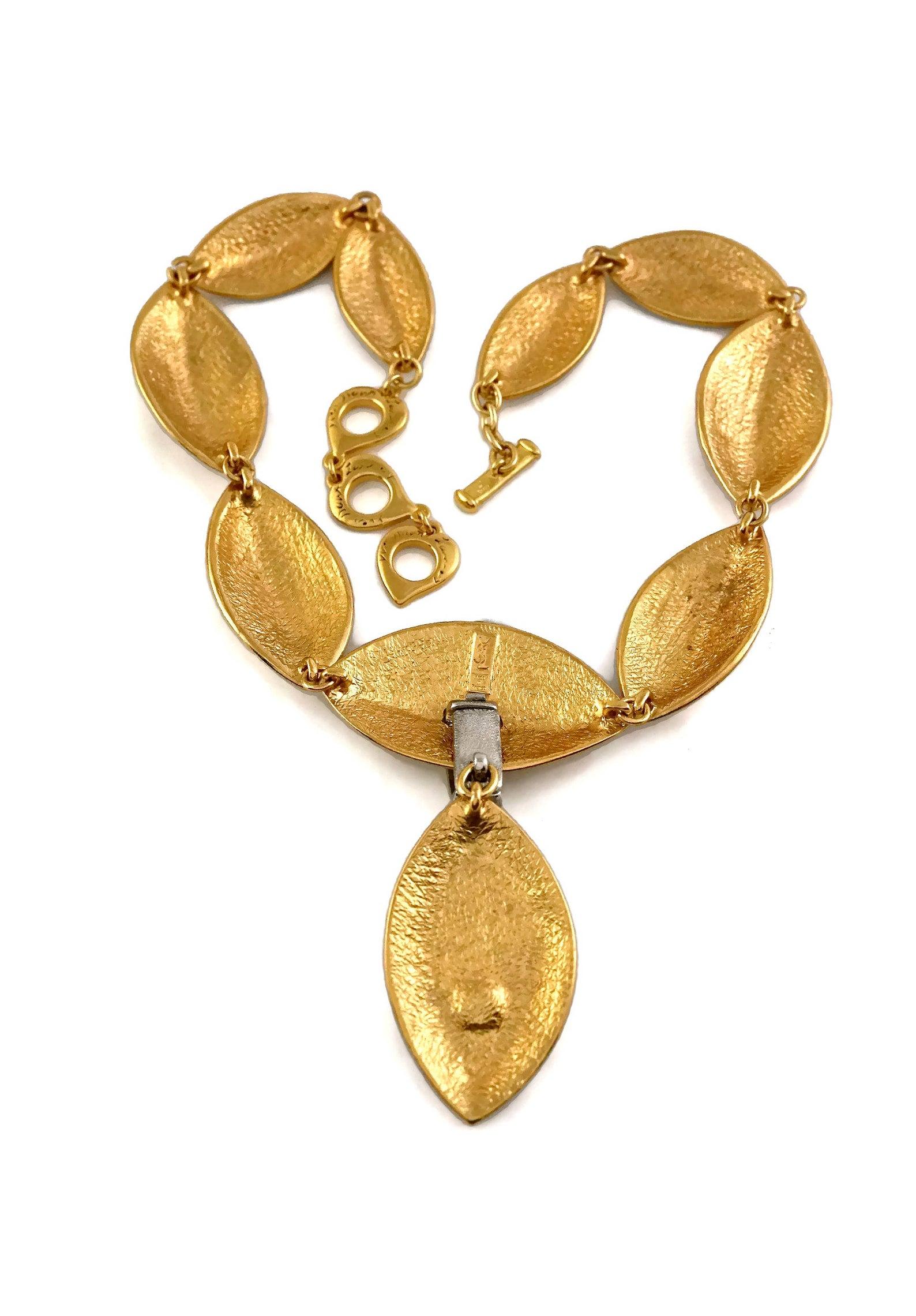 Vintage YVES SAINT LAURENT Ysl Etched Almond Rhinestone Choker Necklace

Measurements:
Centrepiece Height: 4.21 inches (10.7 cm)
Wearable Length: 19.09 inches to 21.06 inches (48.5 cm to 53.5 cm)

Features:
- 100% Authentic YVES SAINT LAURENT by