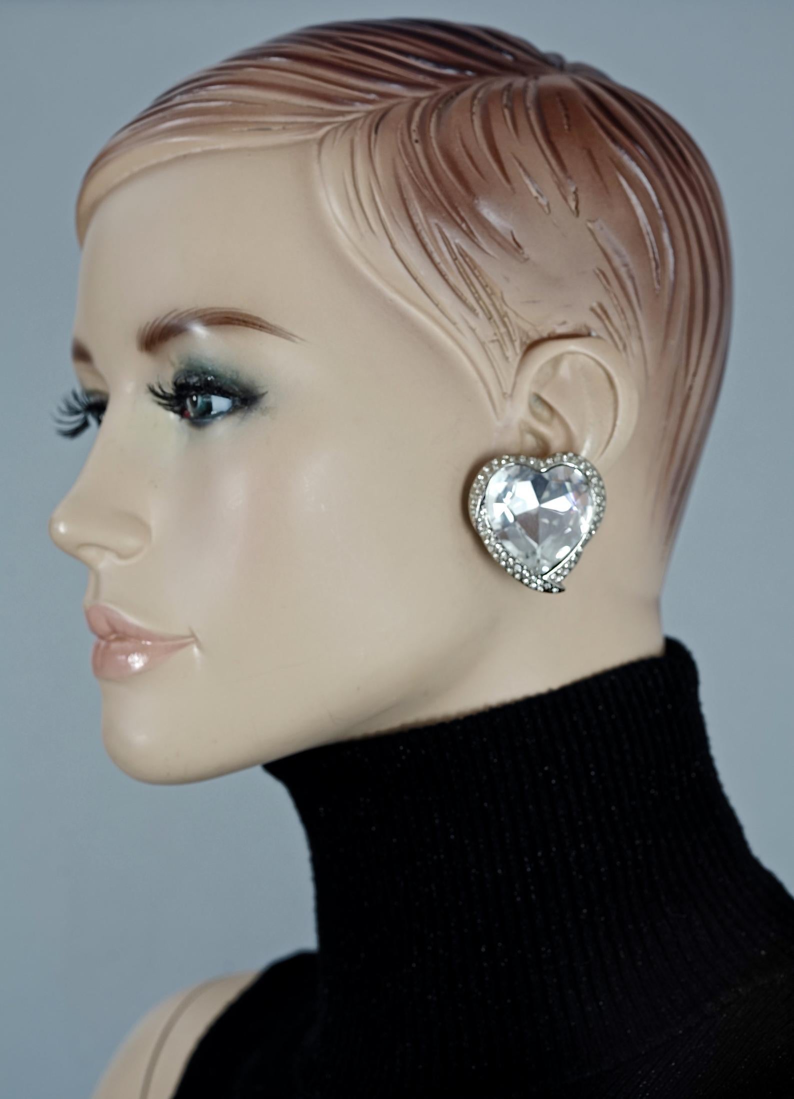 Vintage YVES SAINT LAURENT Ysl Faceted Heart Rhinestone Earrings

Measurements:
Height: 1.42 inches (3.6 cm)
Width: 1.42 inches (3.6 cm)
Weight per Earring: 22 grams

Features:
- 100% Authentic YVES SAINT LAURENT.
- Earrings with raised faceted
