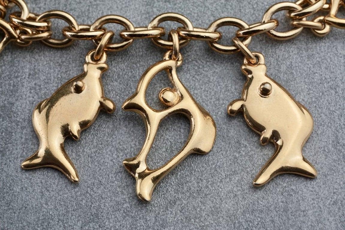 Vintage YVES SAINT LAURENT Ysl Fish Charm Bracelet

Measurements:
Height: 2 2/8inches
Wearable Length: varies as it is adjustable

Features:
- 100% Authentic YVES SAINT LAURENT.
- Chunky chain with dangling fish charms.
- 12 fish charms.
- Signed