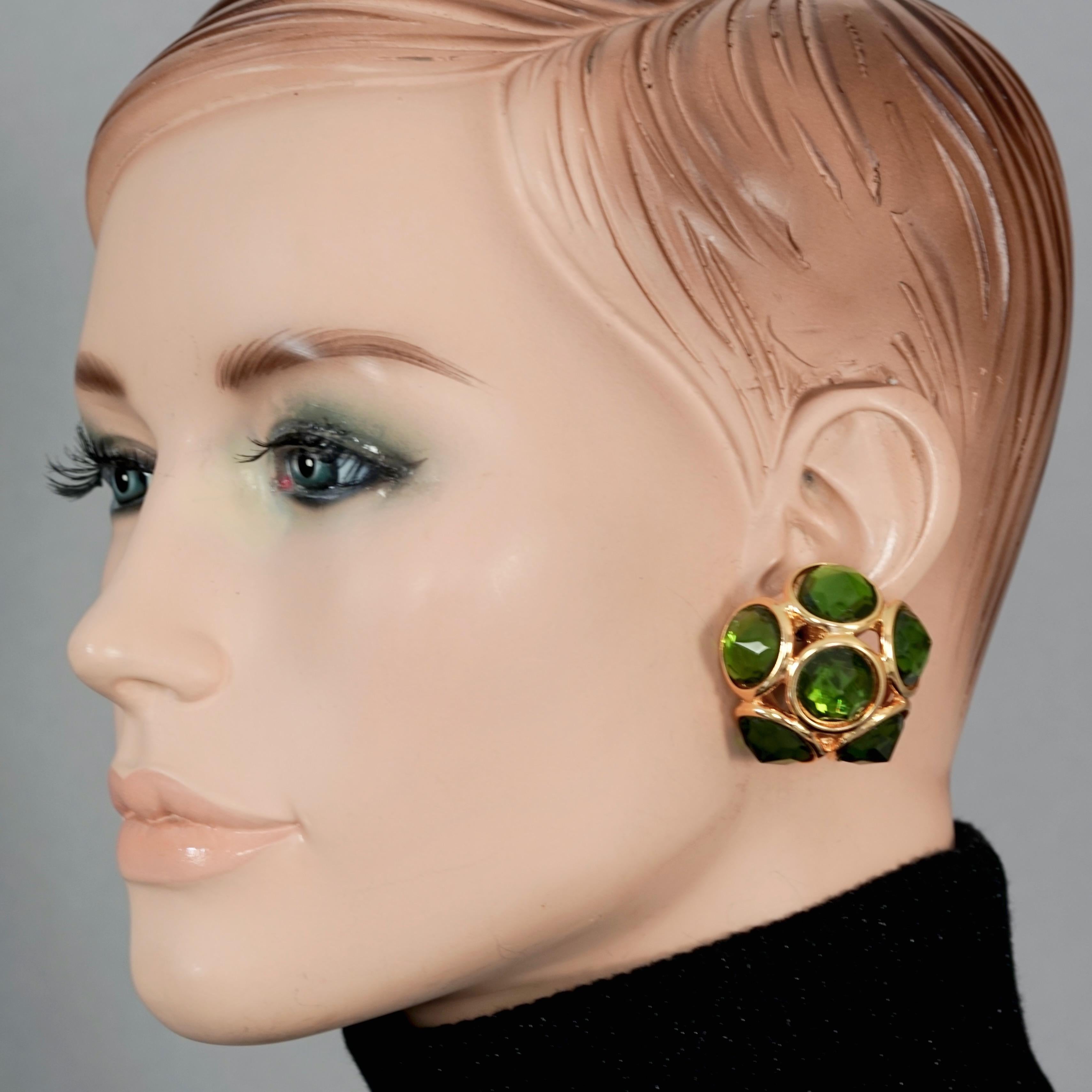 Vintage YVES SAINT LAURENT Ysl Flower Dome Green Rhinestones Earrings

Measurements:
Height: 1.37 inches (3.5 cm)
Width: 1.37 inches (3.5 cm)
Depth: 0.94 inch (2.4 cm)
Weight per Earring: 14 grams

Features:
- 100% Authentic Yves Saint Laurent.
-