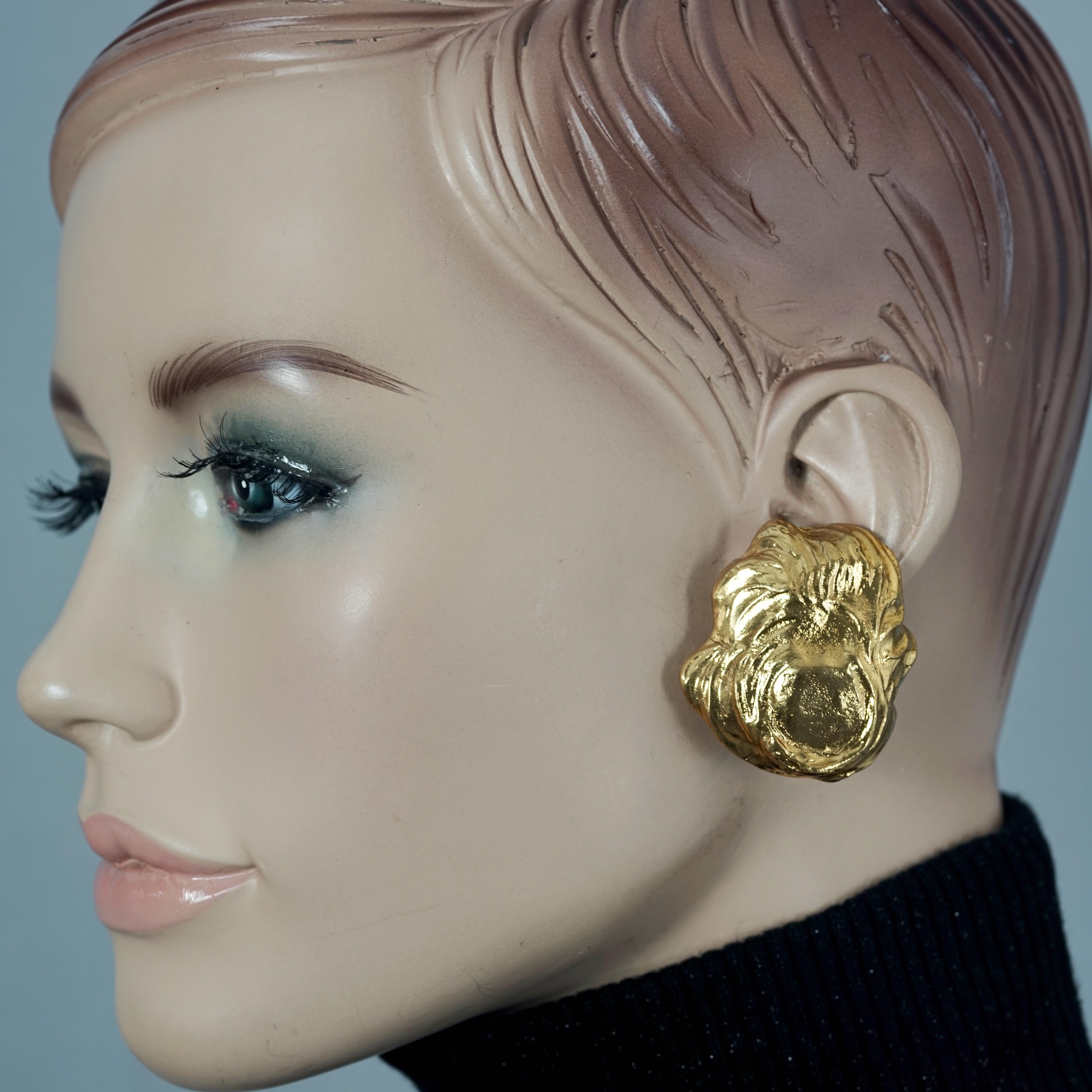 Vintage YVES SAINT LAURENT Ysl Free Form Earrings

Measurements:
Height: 1.65 inches (4.2 cm)
Width: 1.49 inches (3.8 cm)
Weight per Earring: 24 grams

Features:
- 100% YVES SAINT LAURENT.
- Free form textured earrings.
- Signed YSL.
- Clipback