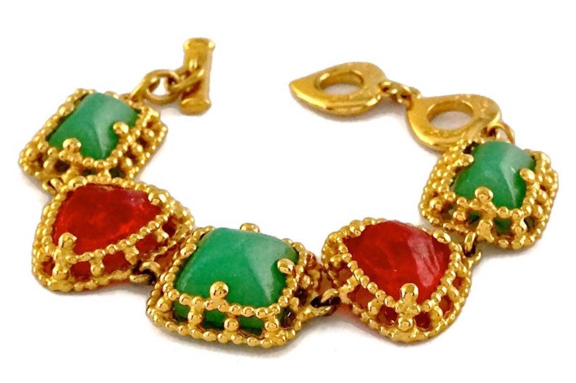 Vintage YVES SAINT LAURENT Ysl Geometric Jade Ruby Glass Poured Link Bracelet

Measurements:
Height: 0.98 inch (2.5 cm)
Wearable Length: 6.69 inches (17 cm) until 7.67 inches (19.5 cm)

Features:
- 100% Authentic YVES SAINT LAURENT.
- Geometric