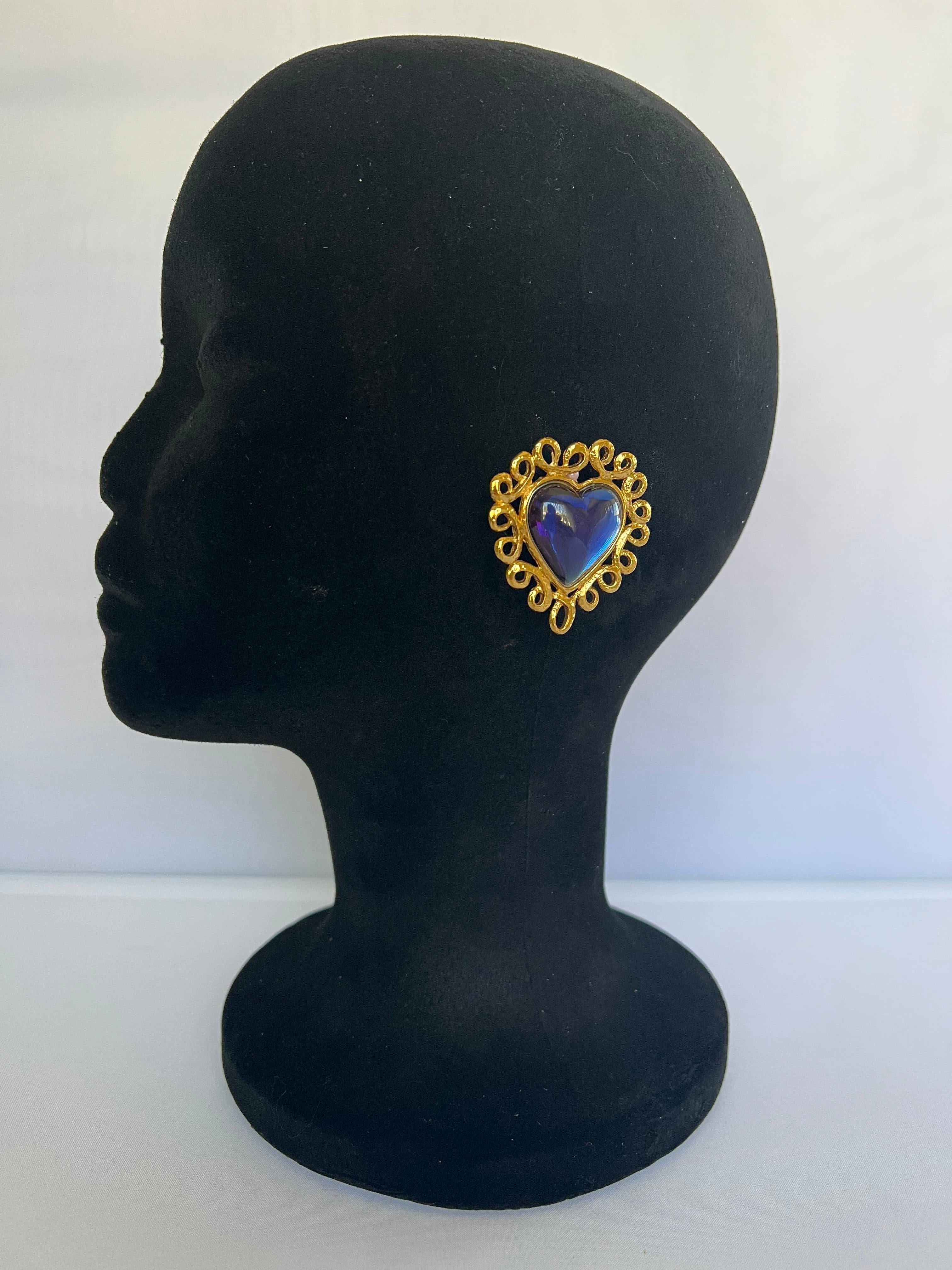Magnificent vintage Yves Saint Laurent (YSL) gilt metal(metal dore)  blue acrylic heart clip-on earrings. Signed YSL on the back of the clip.