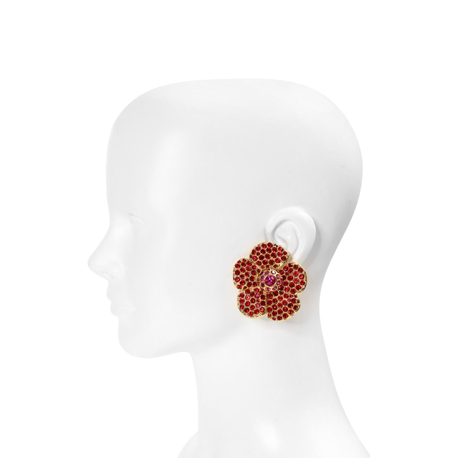 Vintage Yves Saint Laurent YSL Pink and Red Flower Earrings Circa 1980's  These are flower earrings set in gold tone with red crystals and then the small disc in the middle is the one with the pink crystal and is surrounded with pink crystals.  When