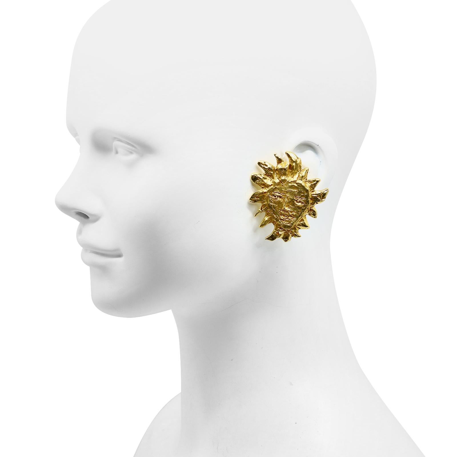 Vintage Yves Saint Laurent YSL Gold Sun Earrings.  These are iconic and classic earrings.  When you wear them you make a style statement that is chic and classic.    Clip On