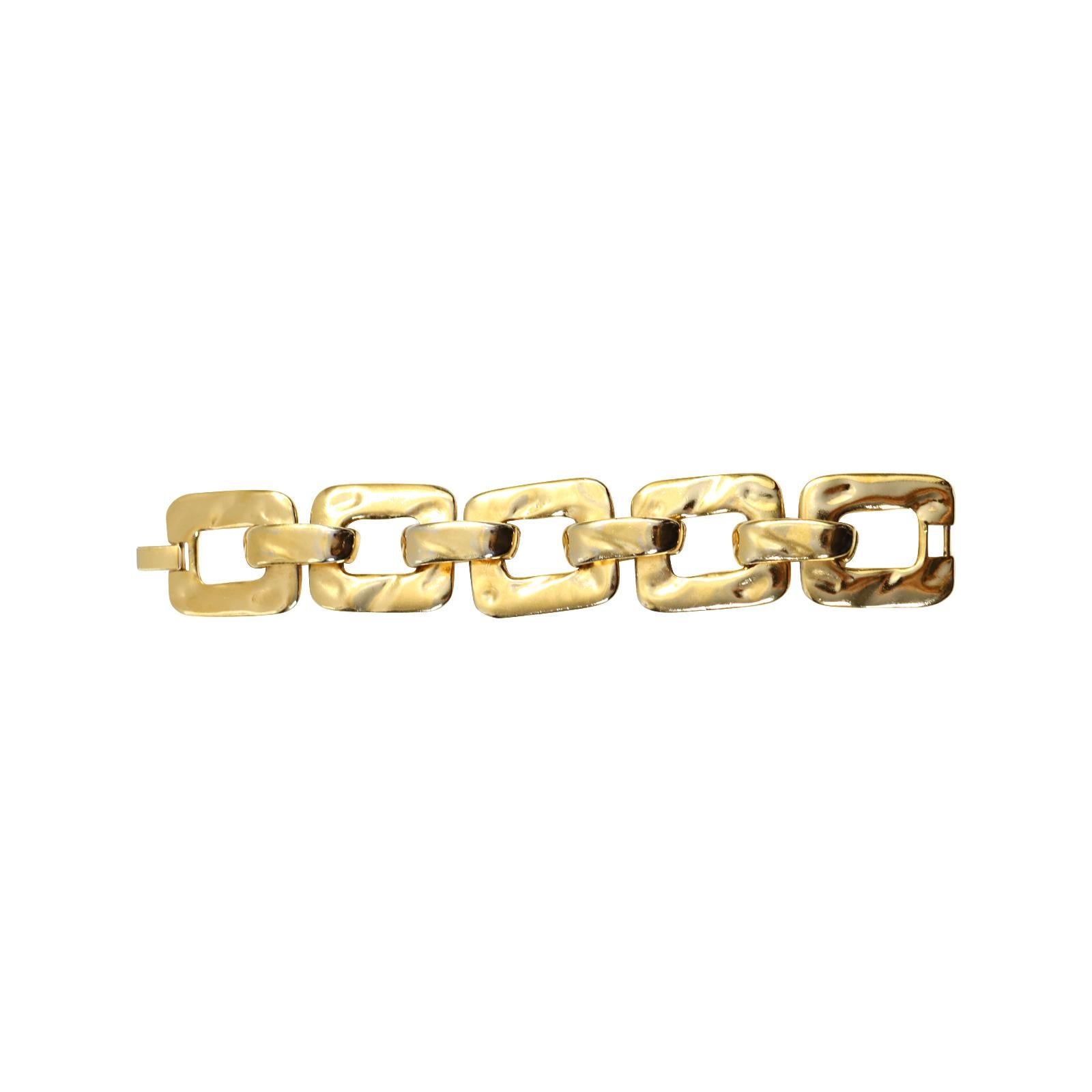 Vintage Yves Saint Laurent YSL Gold Tone Heavy Link Bracelet Circa 1970s.  Signed and Numbered #267 of #425. Special when on.  I have this set myself.  I have managed over the years to acquire the bracelet and the earrings and the necklace all in