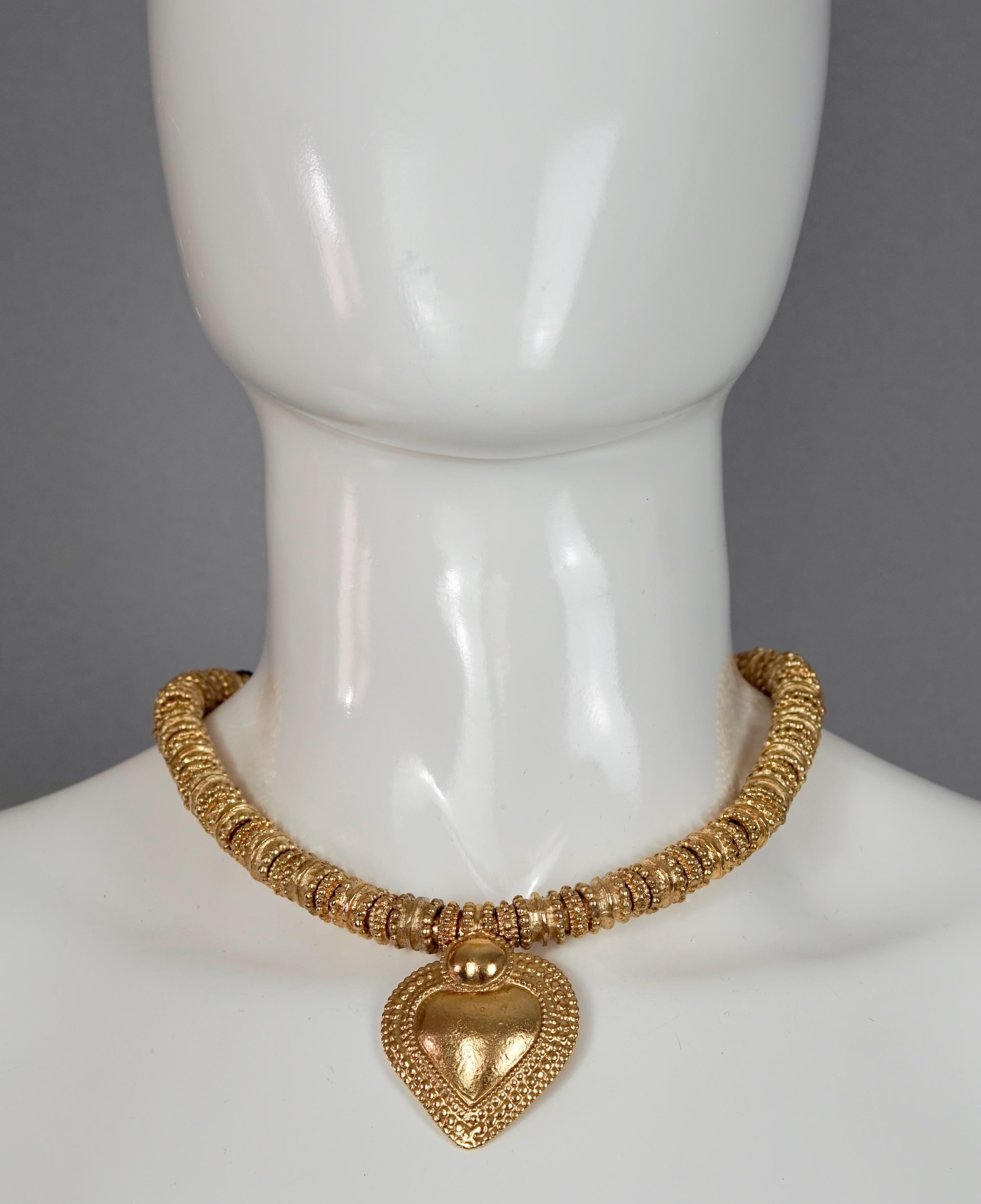 Vintage YVES SAINT LAURENT Ysl Heart Ethnic Link Necklace

Measurements:
Height: 2.08 inches (5.3 cms)
Wearable Length: 17.12 inches (43.5 cms)

Features:
- 100% Authentic YVES SAINT LAURENT by Robert Goossens.
- Ethnic link necklace with heart