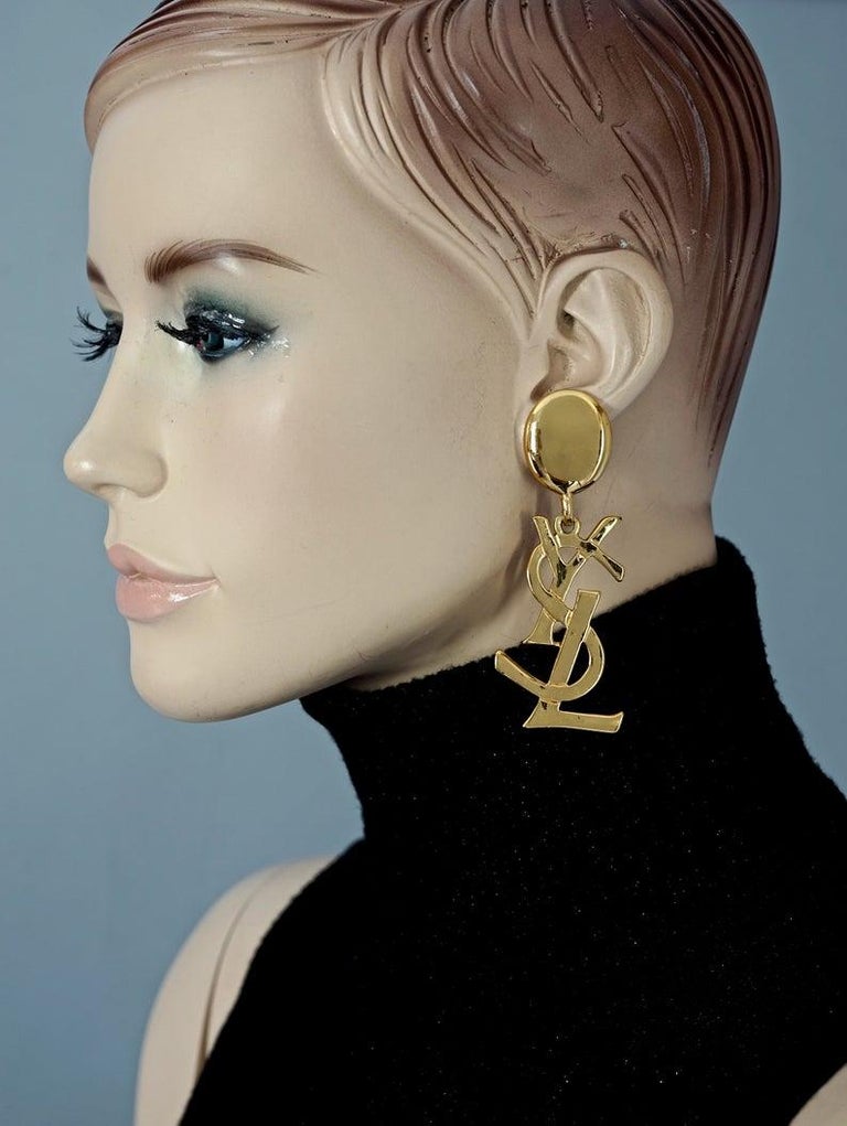 Vintage YVES SAINT LAURENT Ysl Iconic Logo Drop Earrings - Sex and The City  at 1stDibs | ysl earrings, ysl gold earrings, vintage ysl earrings