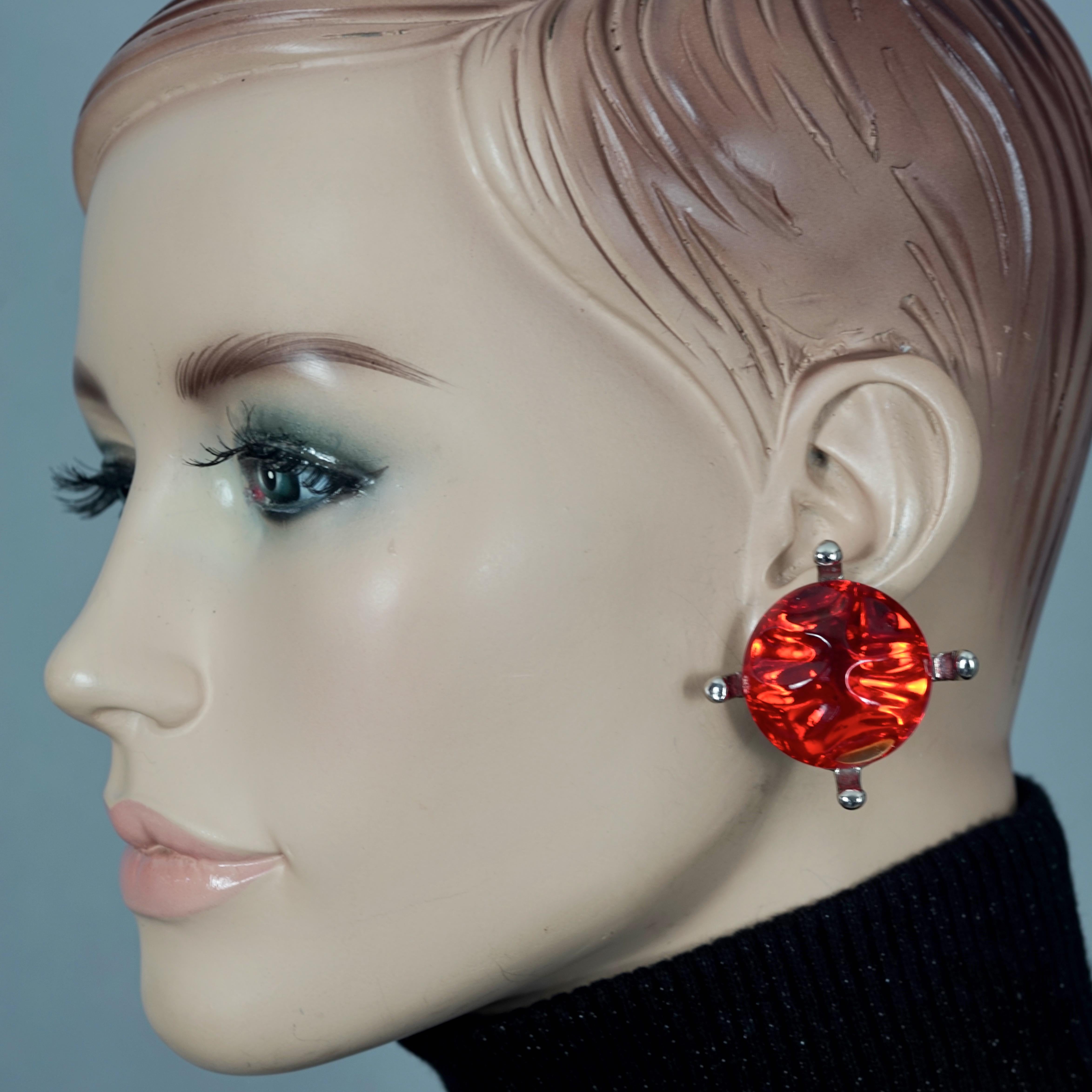 Vintage YVES SAINT LAURENT Ysl Irregular Red Glass Cabochon Earrings

Measurements:
Height: 1.69 inches (4.3 cm)
Width: 1.69 inches (4.3 cm)
Weight per Earring: 23 grams

Features:
- 100% Authentic YVES SAINT LAURENT.
- Irregular red glass