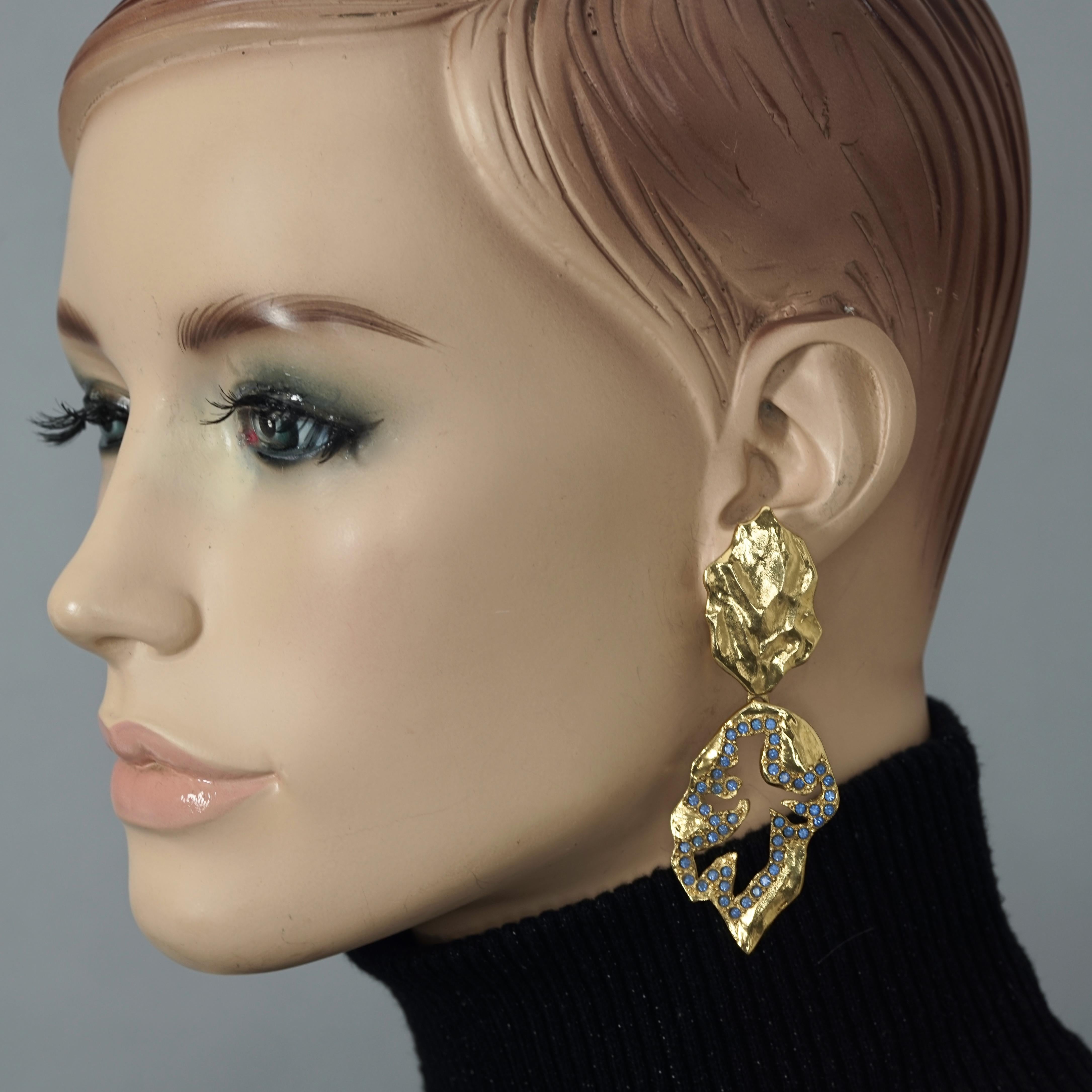 Vintage YVES SAINT LAURENT Ysl  Jeweled Openwork Leaf Dangling Earrings

Measurements:
Height: 3.07 inches (7.8 cm)
Width: 1.10 inches (2.8 cm)
Weight per Earring: 16 grams

Features:
- 100% Authentic YVES SAINT LAURENT.
- Openwork dangling earrings