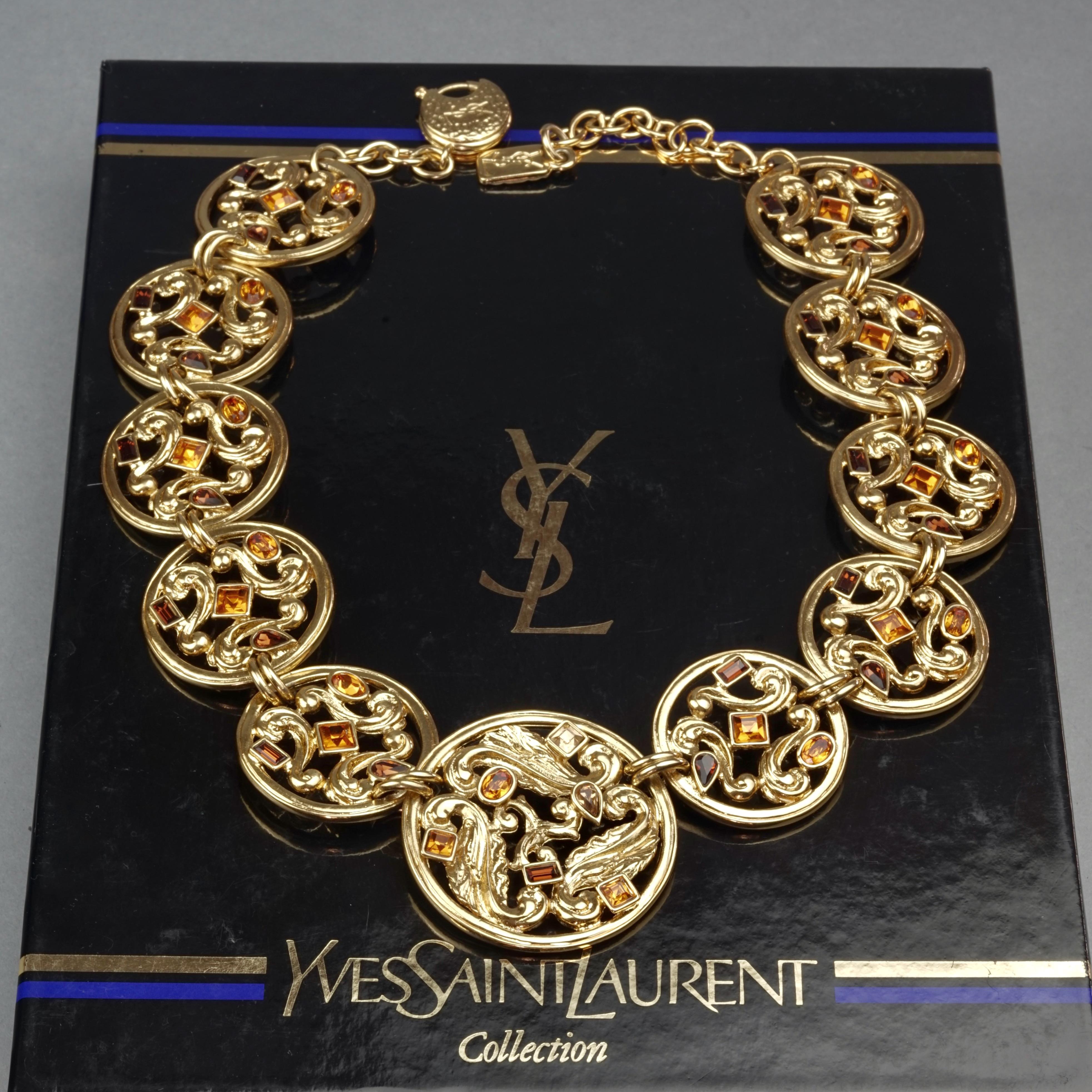 Vintage YVES SAINT LAURENT Ysl Jewelled Round Filigree Disc Necklace

Measurements:
Height: 1.81 inches (4.6 cm)
Width: 17.71 inches (45 cm) to 19.68 inches (50 cm)

Features:
- 100% Authentic YVES SAINT LAURENT.
- Openwork medallion links with