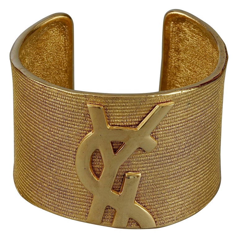 vintage yves saint laurent ysl logo asymmetric cuff bracelet