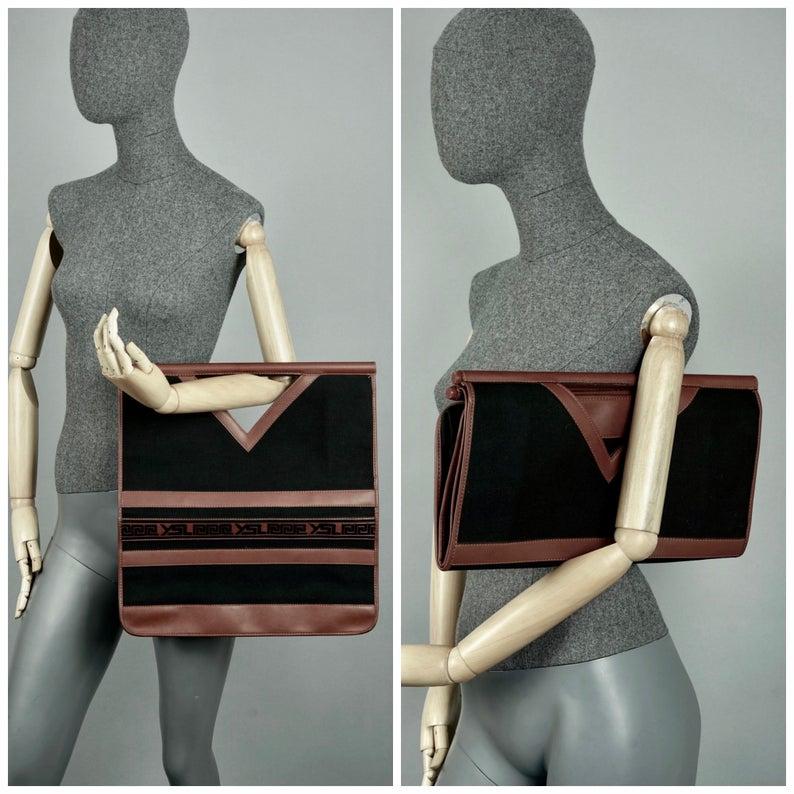 Vintage YVES SAINT LAURENT Ysl Logo Foldable Envelope Leather Clutch Bag

Measurements:
Height: 15.94 inches (40.5 cm) when open
8.85 inches (22.5 cm) when folded
Width: 15.55 inches (39.5 cm)

Features:
- 100% Authentic YVES SAINT LAURENT.
- Black