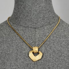 YVES SAINT LAURENT Collier pendentif serpent côtelé vintage avec logo Ysl