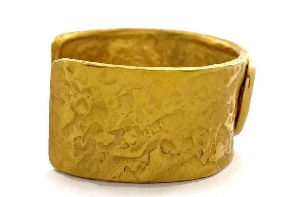 Vintage YVES SAINT LAURENT Ysl Love Heart Hammered Cuff Bracelet

Measurements:
Height: 1.14 inches (2.9 cm)
Circumference: 5.90 inches (15 cm)

Features:
- 100% Authentic YVES SAINT LAURENT.
- Heart centrepiece with engraved LOVE.
- Hammered gilt