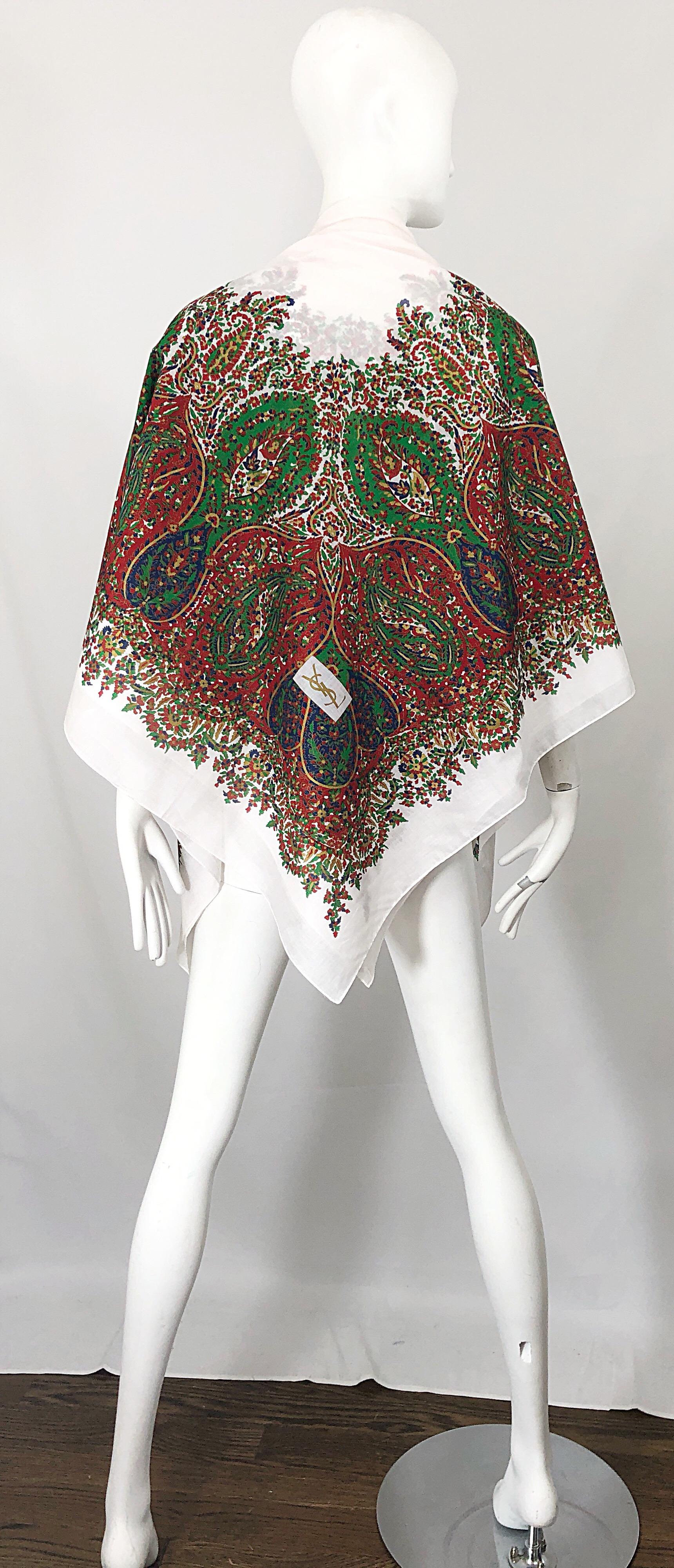 Vintage YVES SAINT LAURENT massive (55 inches by 55 inches) lightweight hand painted cotton voile shawl / scarf! Features vibrant colors of red, gold, green, blue and white throughout. Gold YSL logo at bottom right corner. Can be worn many different