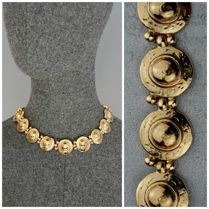 Vintage YVES SAINT LAURENT Ysl Medallion Link Choker Necklace

Measurements:
Height: 0.90 inch (2.3 cm)
Wearable Length: 16.14 inches until 16.92 inches (41 cm to 43 cm)

Features:
- 100% Authentic YVES SAINT LAURENT.
- Textured discs with dome at