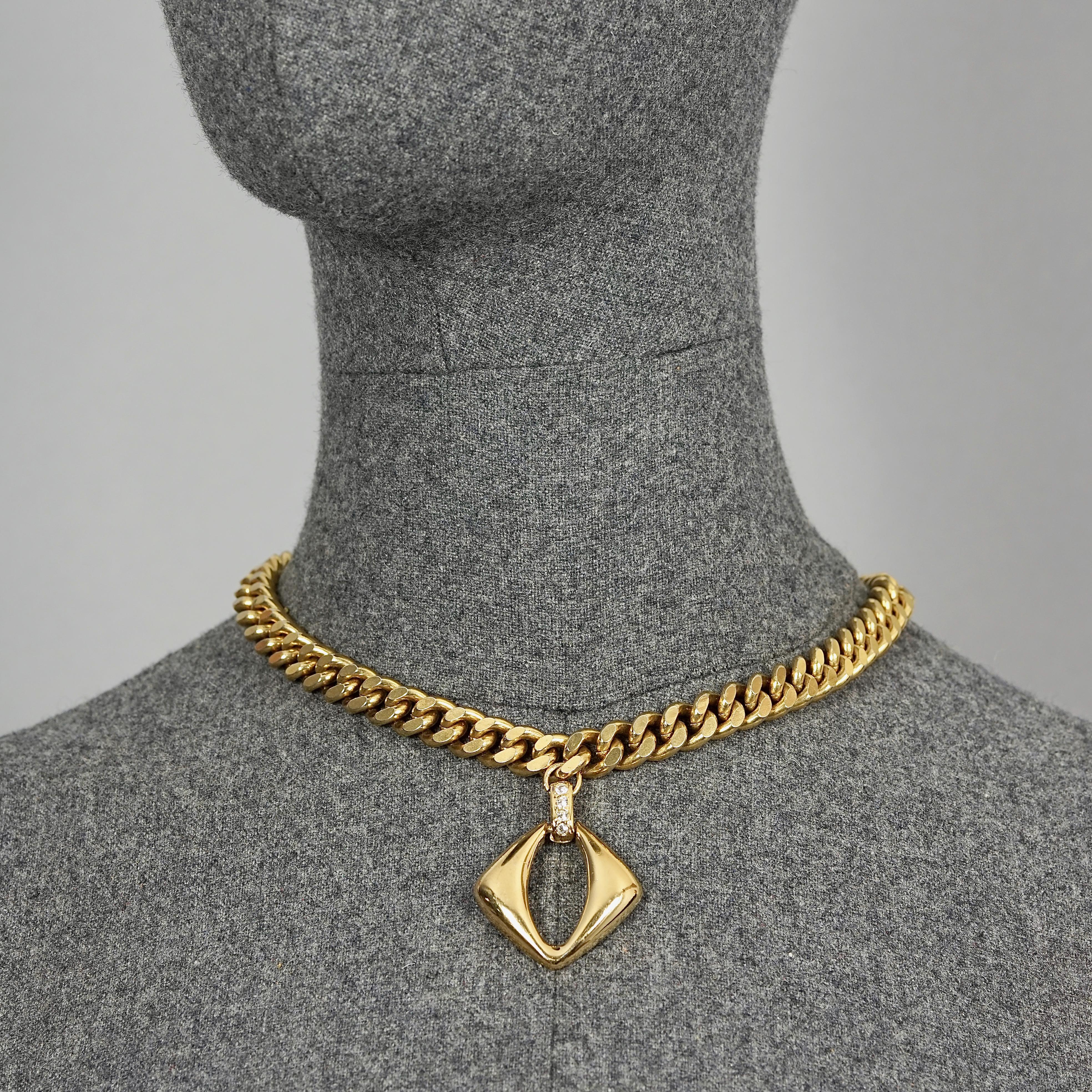 Vintage YVES SAINT LAURENT Ysl Openwork Diamond Chain Necklace

Measurements:
Height: 1.65 inches (4.2 cm)
Wearable Length: 17.12 inches (43.5 cm) 

Features:
- 100% Authentic YVES SAINT LAURENT.
- Openwork diamond with rhinestone pendant.
- Lobster