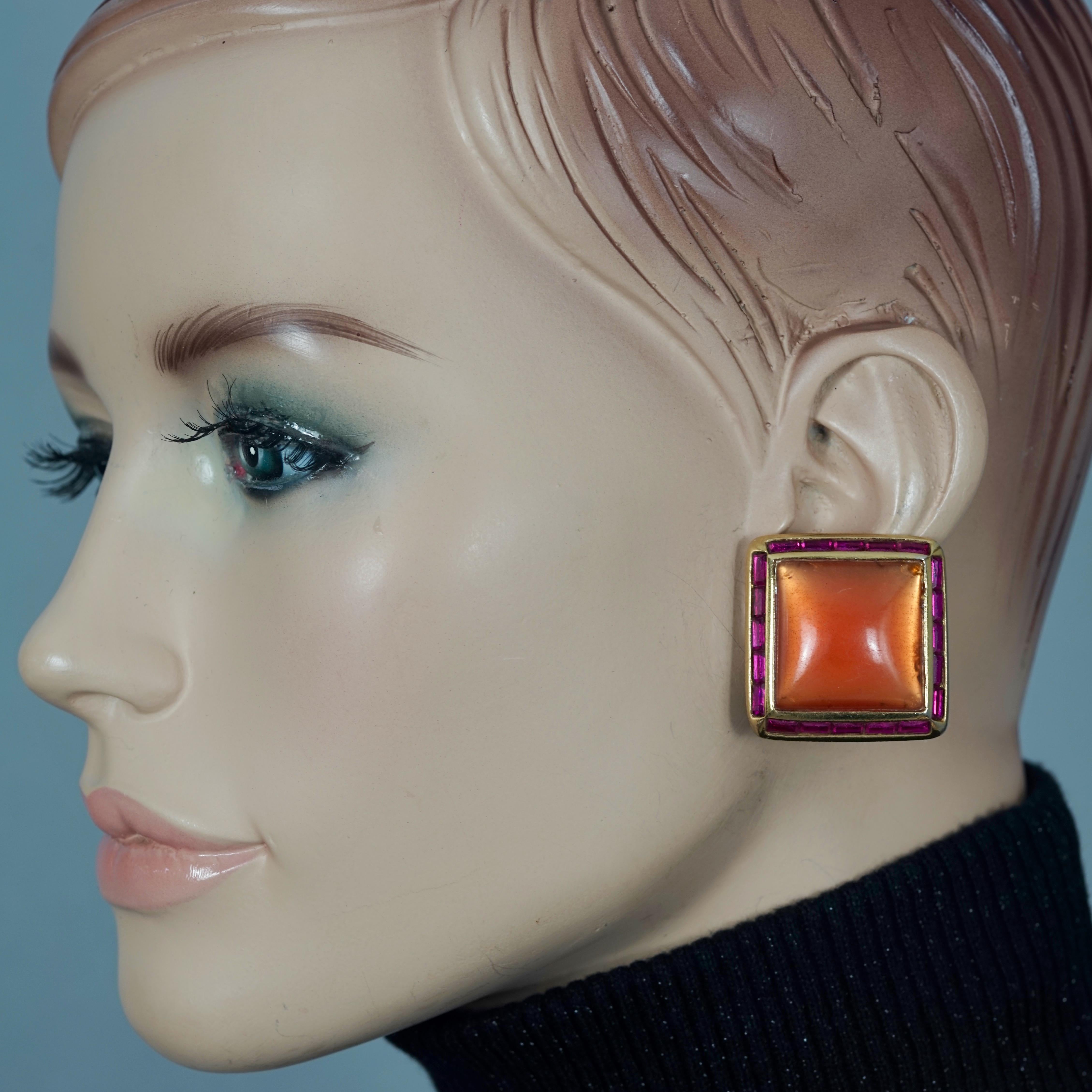 Vintage YVES SAINT LAURENT Ysl Orange Resin Rhinestone Earrings

Measurements:
Height: 1.26 inches (3.2 cm)
Width: 1.26 inches (3.2 cm)
Weight per Earring: 15 grams

Features:
- 100% Authentic YVES SAINT LAURENT.
- Square and orange resin earrings