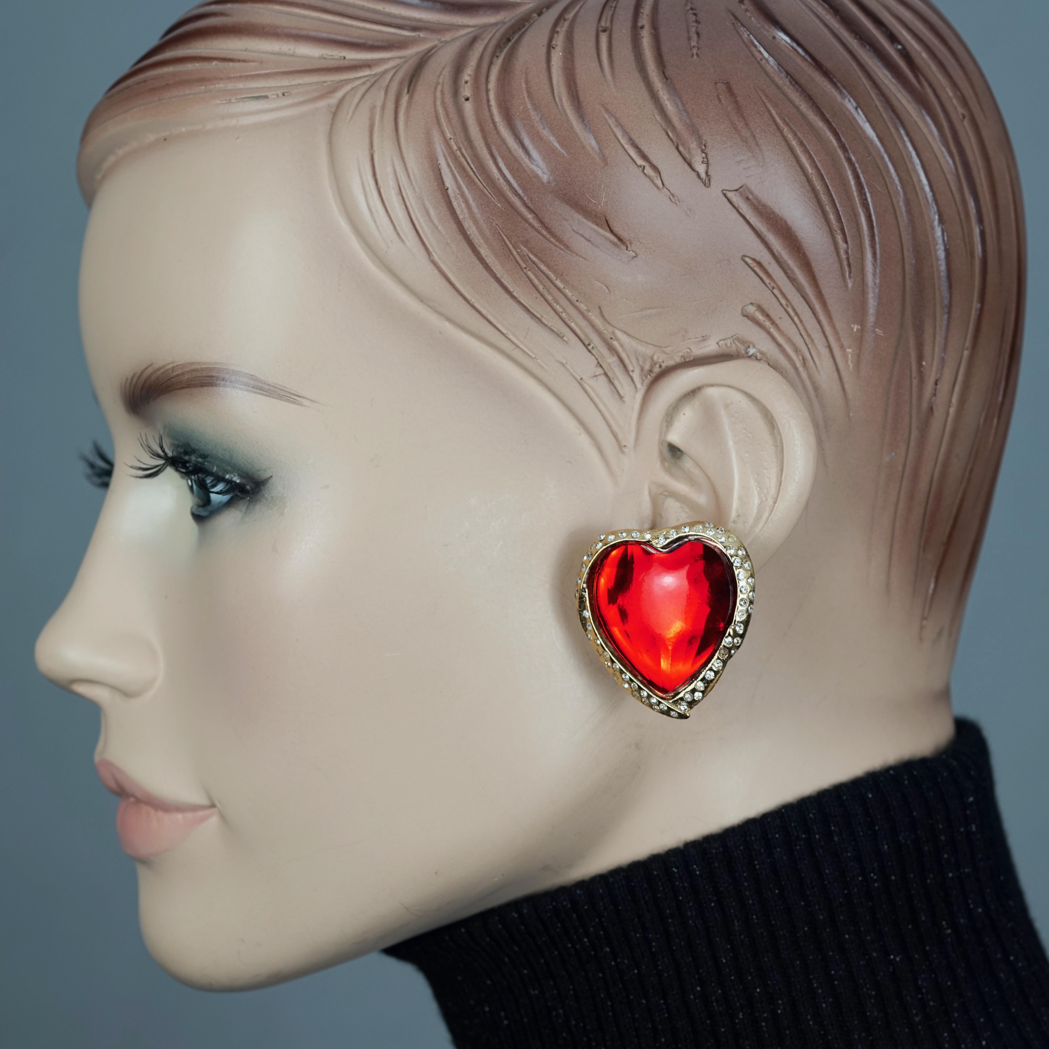 Vintage YVES SAINT LAURENT Ysl Red Faceted Heart Rhinestone Earrings

Measurements:
Height: 1.37 inches (3.5 cm)
Width: 1.30 inches (3.3 cm)
Weight per Earring: 14 grams

Features:
- 100% Authentic YVES SAINT LAURENT.
- Raised faceted red heart