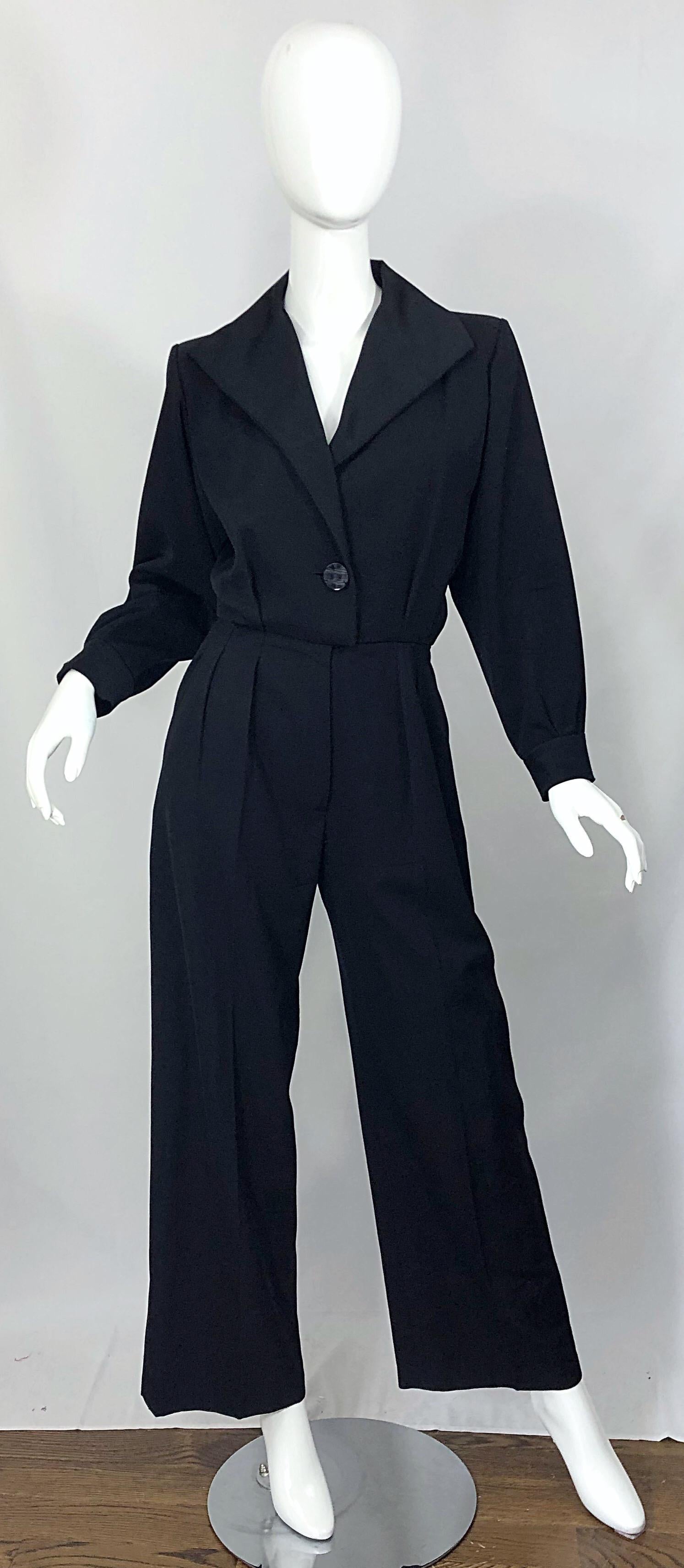 Effortlessly chic, timeless and classic vintage YVES SAINT LAURENT YSL Rive Gauche black long sleeve le smoking tuxedo jumpsuit! Signature YSL exaggerated lapels. Single button closure with hidden zipper fly and multiple hook-and-eye closures.