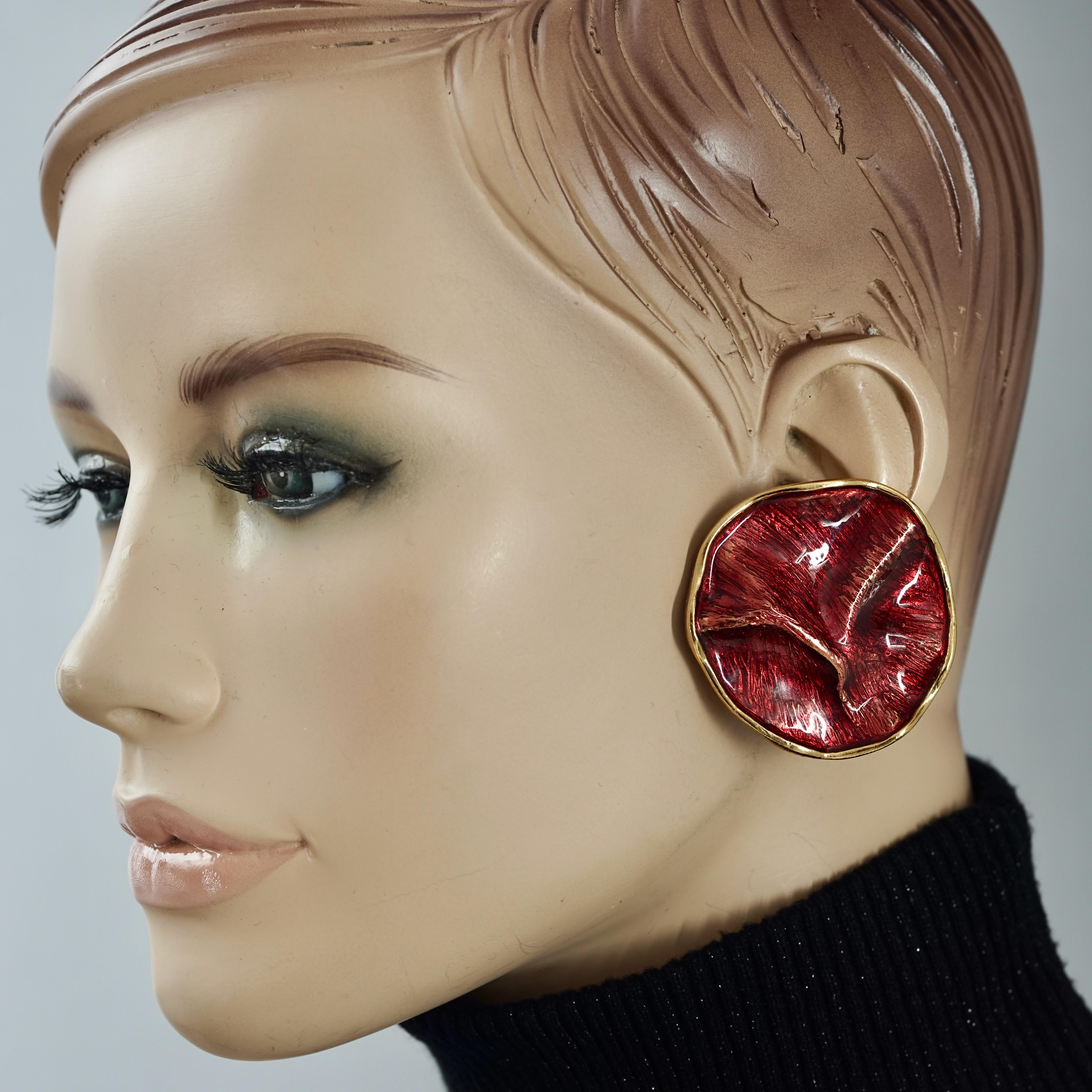 Vintage YVES SAINT LAURENT Ysl by Robert Goossens Wrinkled Red Enamel Disc Earrings

Measurements:
Height: 1.81 inches (4.6 cm)
Width: 1.81 inches (4.6 cm)
Weight per Earring: 25 grams

Features:
- 100% Authentic YVES SAINT LAURENT by Robert