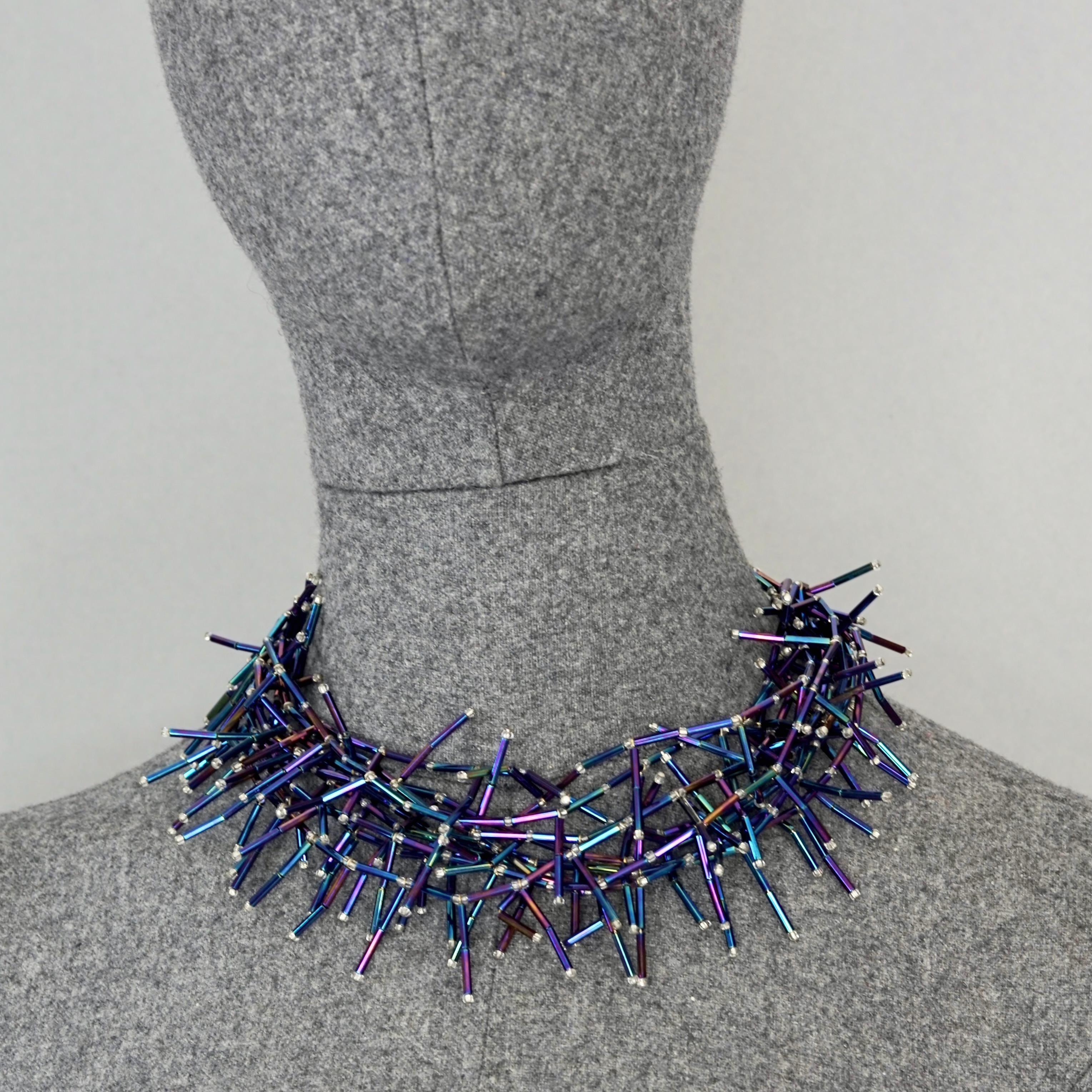 Vintage YVES SAINT LAURENT Ysl Spiky Iridescent Blue Glass Bead Choker Necklace

Measurements:
Height: 3.94 inches (10 cm)
Length: 13.77 inches to 25.19 inches (35 cm to 64 cm) adjustable

Features:
- 100% Authentic YVES SAINT LAURENT.
- Spiky