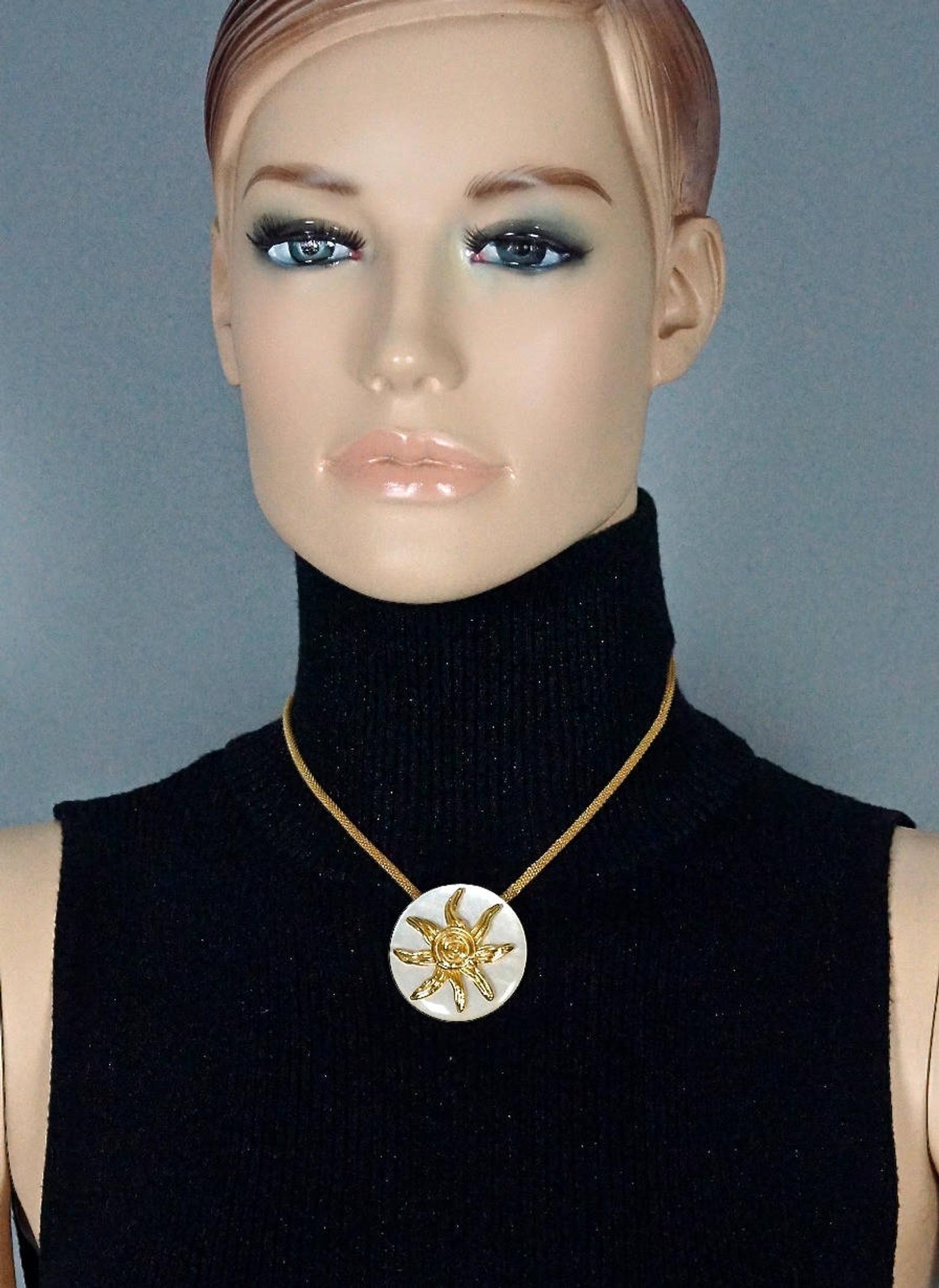 Vintage YVES SAINT LAURENT Ysl Sun Spiral Pearly White Medallion Disc Necklace

Measurements:
Medallion: 1.61 inches (4.1 cm)
Wearable Length: 16.73 inches to 18.70 inches (42.5 cm to 47.5 cm)
Weight: 23 grams

Features:
- 100% Authentic YVES SAINT