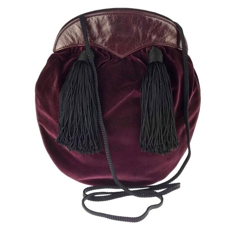 Vintage YVES SAINT LAURENT Ysl Velvet Tassel Russian Collection Bag

Measurements:
Height: 9.84 inches (25 cm)
Width: 8.66 inches (22 cm)
Strap: 48.42 inches (123 cm)

Features:
- 100% Authentic YVES SAINT LAURENT.
- Bordeaux velvet shoulder bag.
-