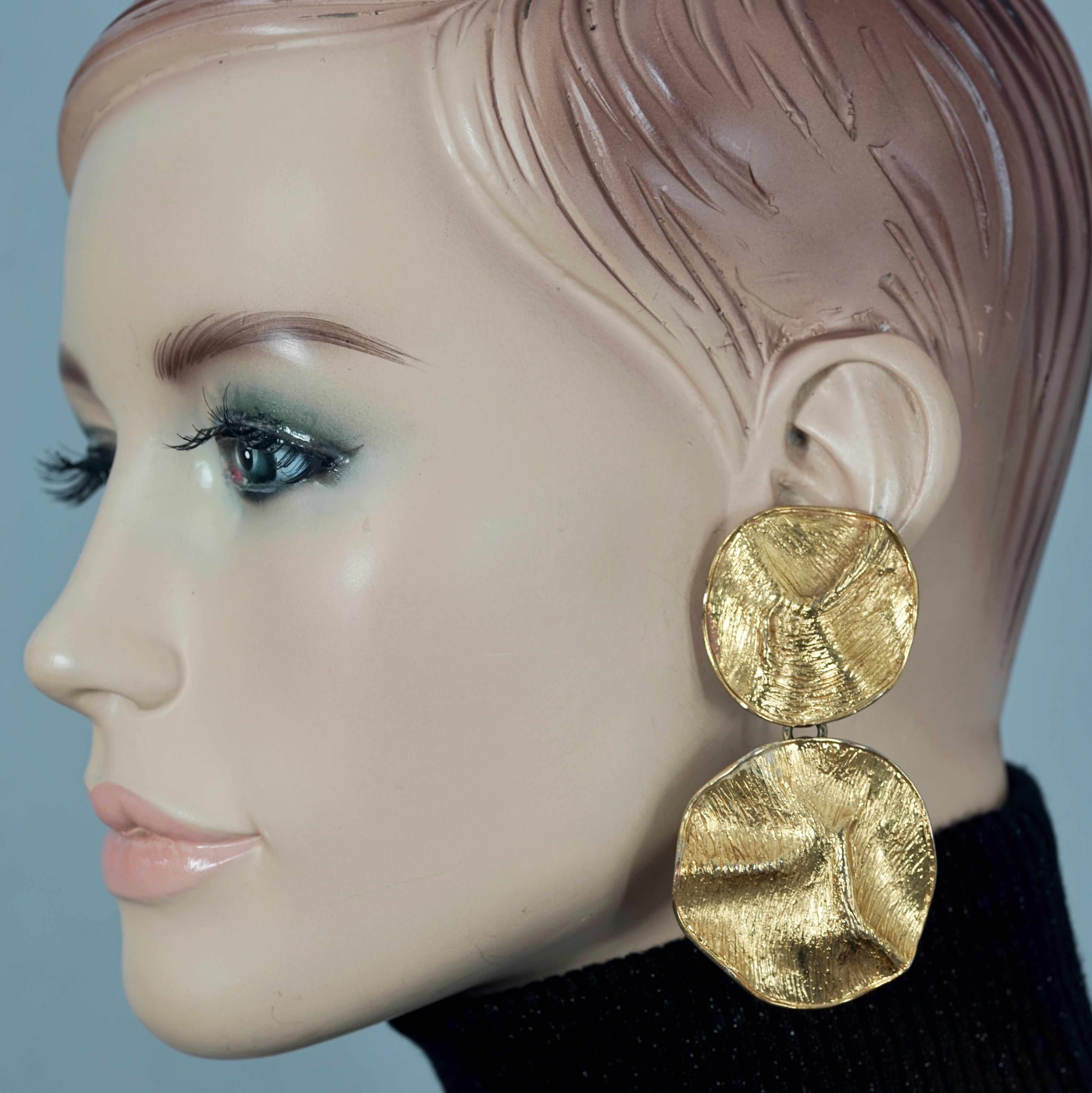 Vintage YVES SAINT LAURENT Ysl Wrinkled Textured Disc Dangling Earrings

Measurements:
Height: 3.15 inches  (8 cms)
Width: 1.69 inches (4.3 cms)
Weight per Earring: 30 grams

Features:
- 100% Authentic YVES SAINT LAURENT by Robert Goossens .
-