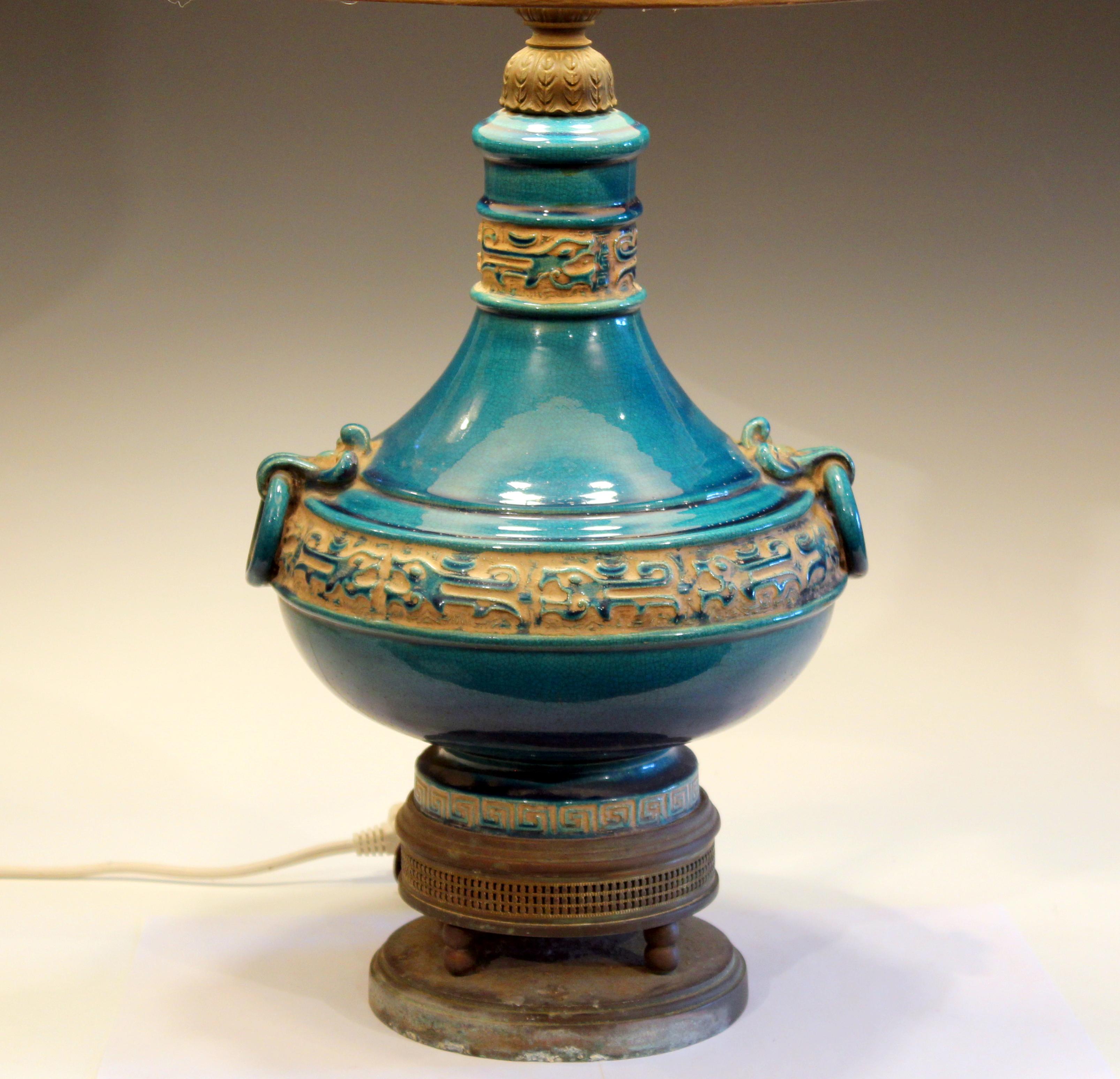 Zaccagnini pottery of Florence Italian lamp with ring handles and vibrant turquoise glaze, circa 1950s. Double socket cluster with new sockets. Corrosion to brass base, as shown. Measures: 28